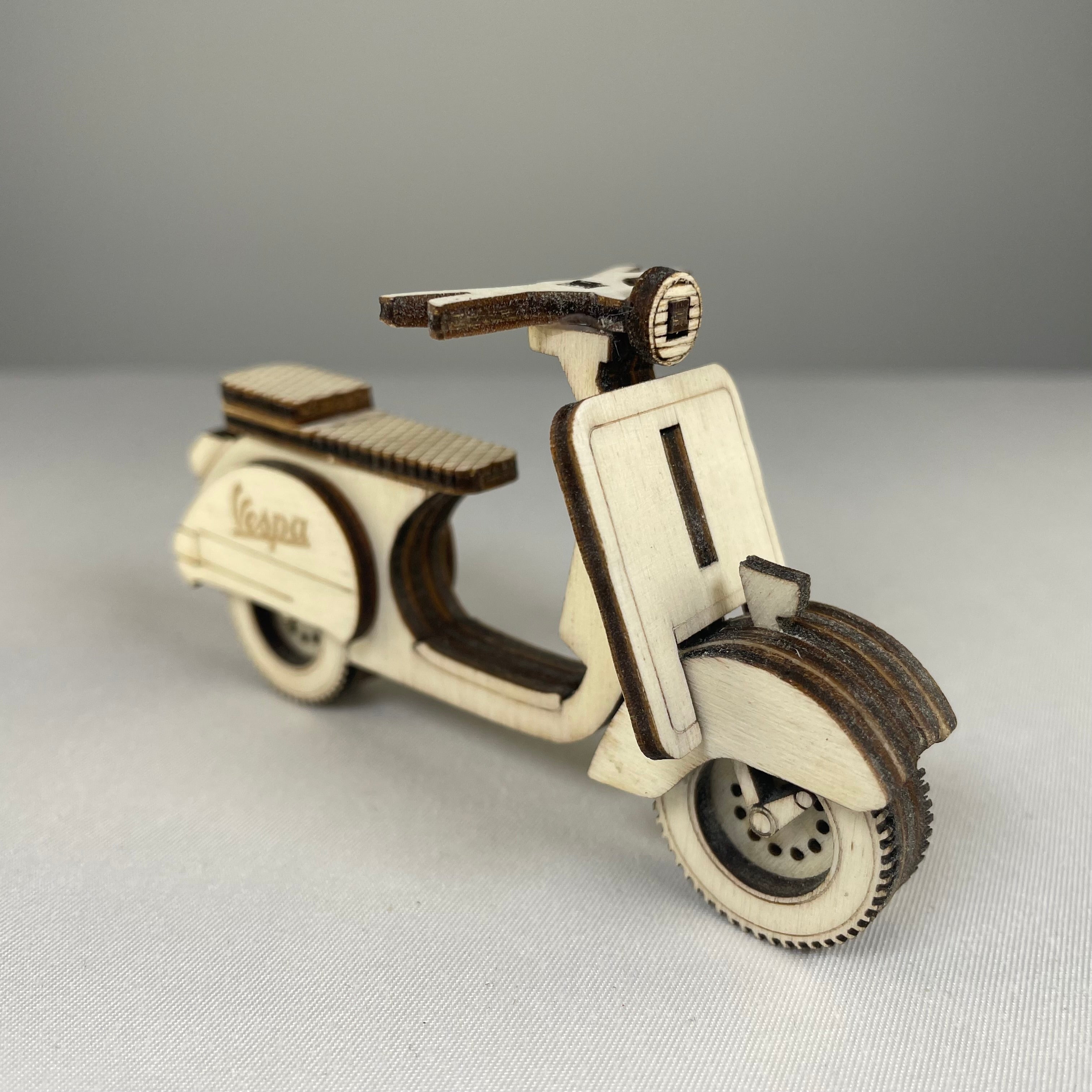 Handmade vintage retro scooter bauble ornament by Curious Rabbit, featuring a colorful, detailed miniature scooter for holiday decor.