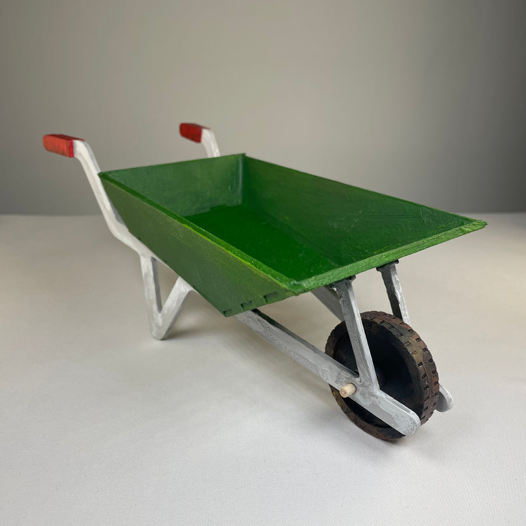 Curious Rabbit garden wheelbarrow planter kit, flatpack model with soil and plants, suitable for outdoor garden decoration.