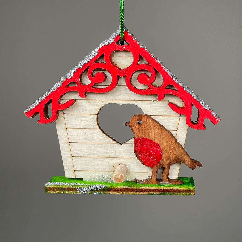 Handmade Curious Rabbit Christmas birdhouse bauble ornament with festive holiday design on a white background.