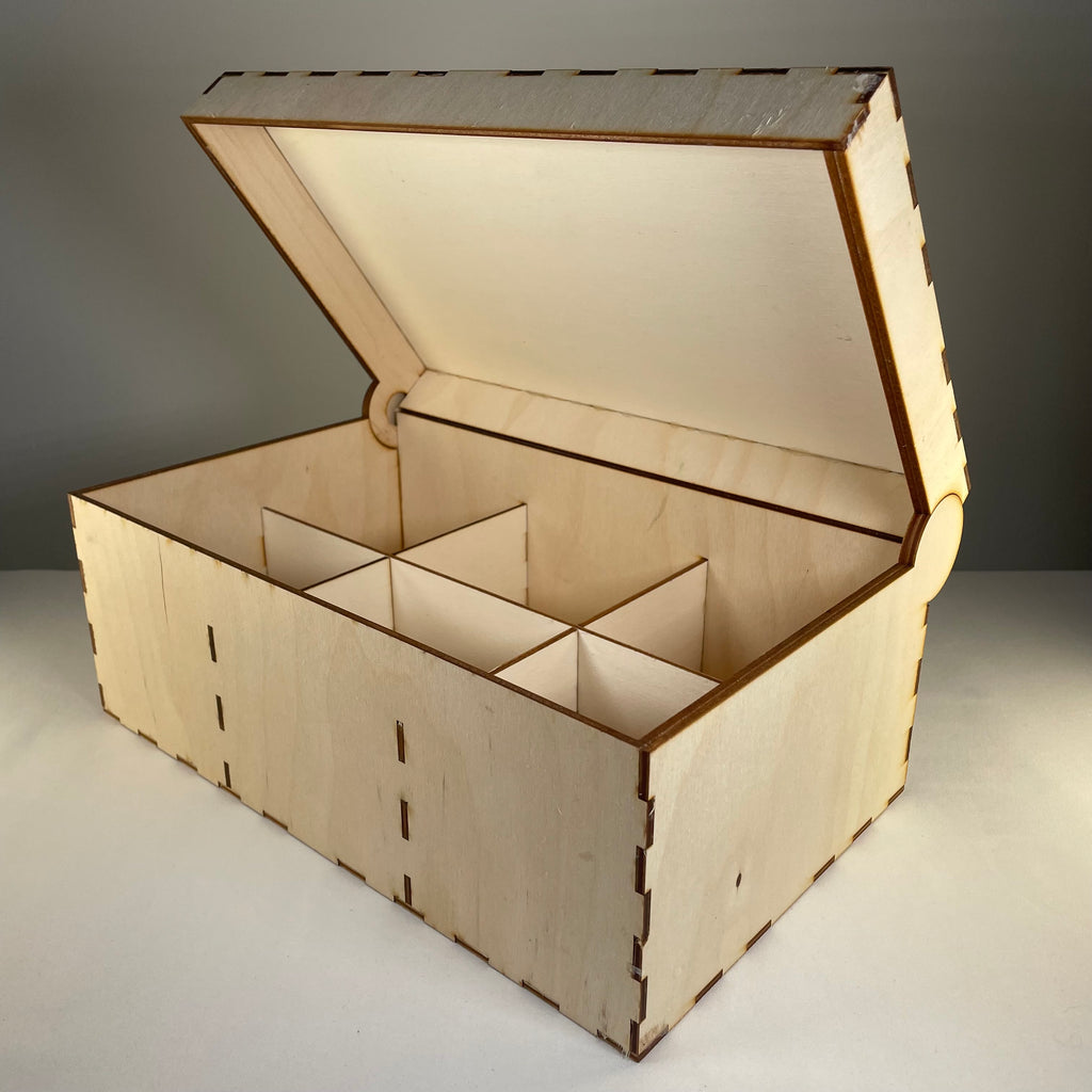 Curious Rabbit seedbox with lid, flatpack garden kit, showing assembled wooden seed storage box with lid on a garden surface.