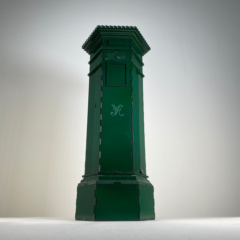 Curious Rabbit Penfold Pillar Post Box flatpack model kit icon, showing detailed miniature postal box with realistic design elements.