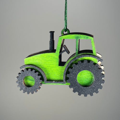 Handmade Curious Rabbit tractor garden bauble ornament hanging outdoors with detailed craftsmanship and rustic charm.