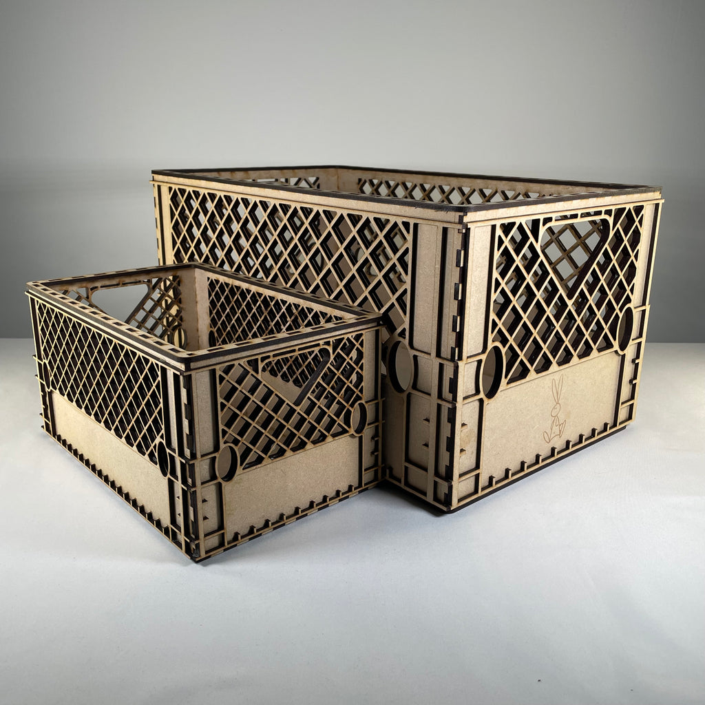 Vintage Curious Rabbit flatpack milk crate model kit, showing assembled wooden crate with slatted sides and sturdy handle design.