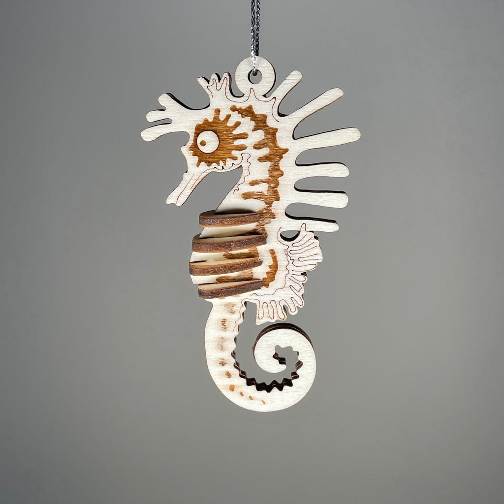 Curious Rabbit Seahorse Bauble flatpack model kit for beach-themed decor, featuring a detailed seahorse design and vibrant colors.