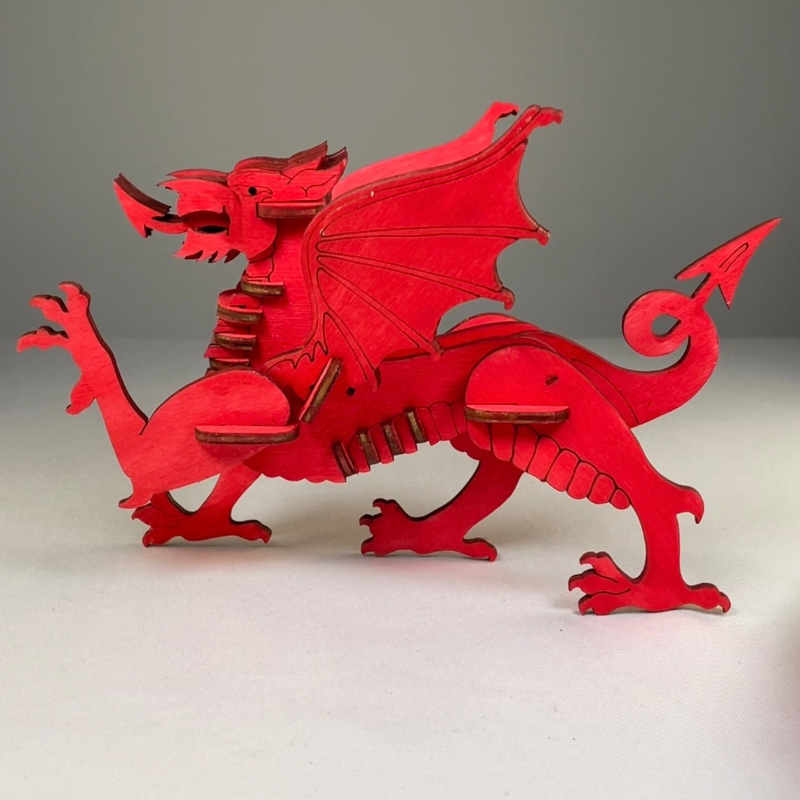 Curious Rabbit Welsh Dragon puzzle flatpack model kit featuring detailed images of assembled dragon with vibrant colors.