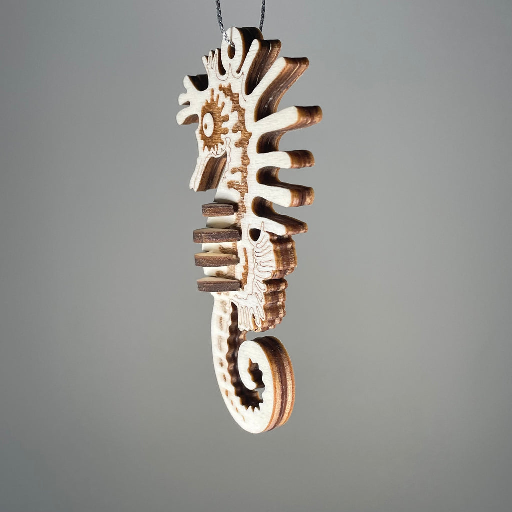 Curious Rabbit Seahorse Bauble flatpack model kit for beach decor, featuring a detailed seahorse design and vibrant colors.