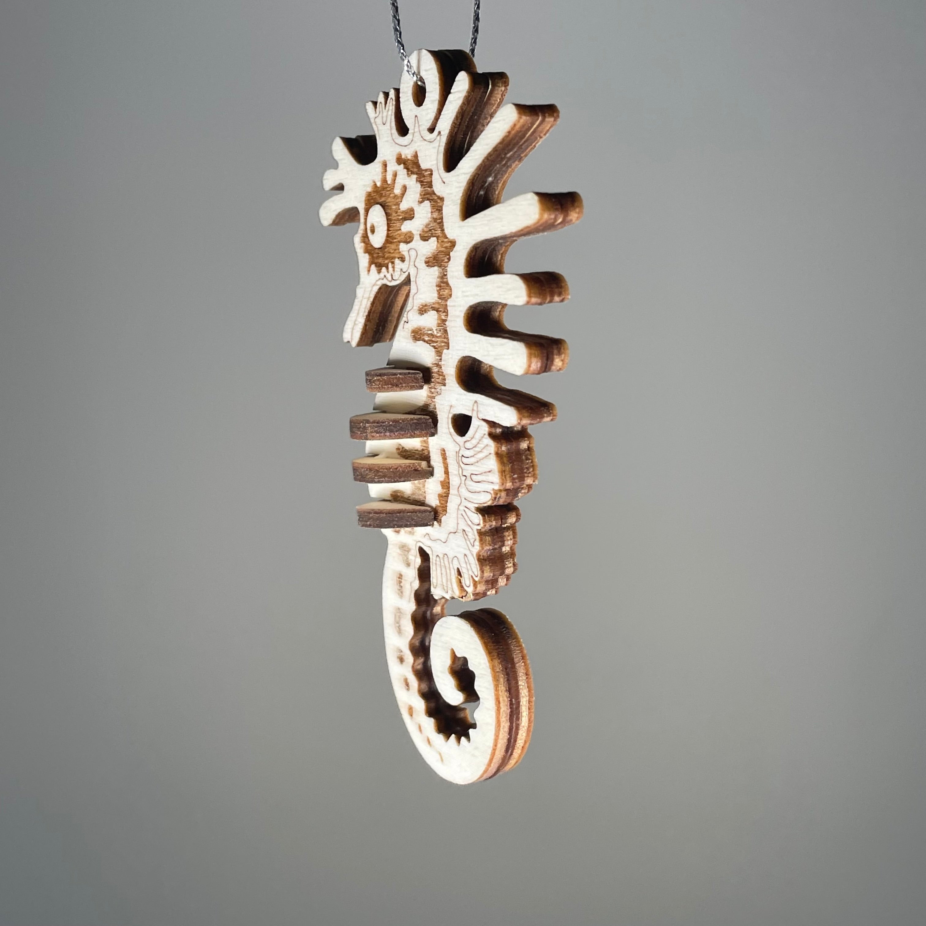 Curious Rabbit Seahorse Bauble flatpack model kit for beach decor, featuring a detailed seahorse design and vibrant colors.