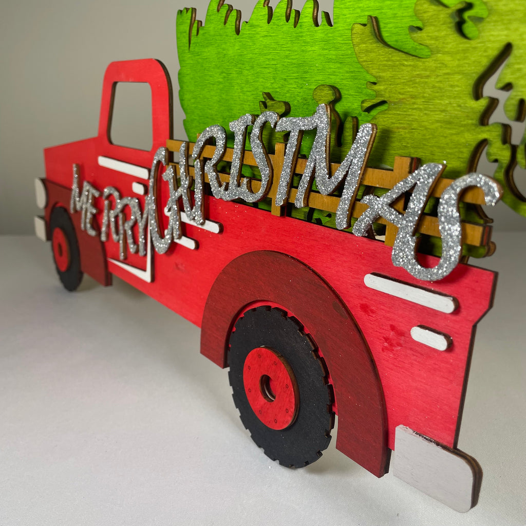 Handmade Curious Rabbit Merry Christmas truck tree sign ornament with festive holiday design for Christmas decoration.