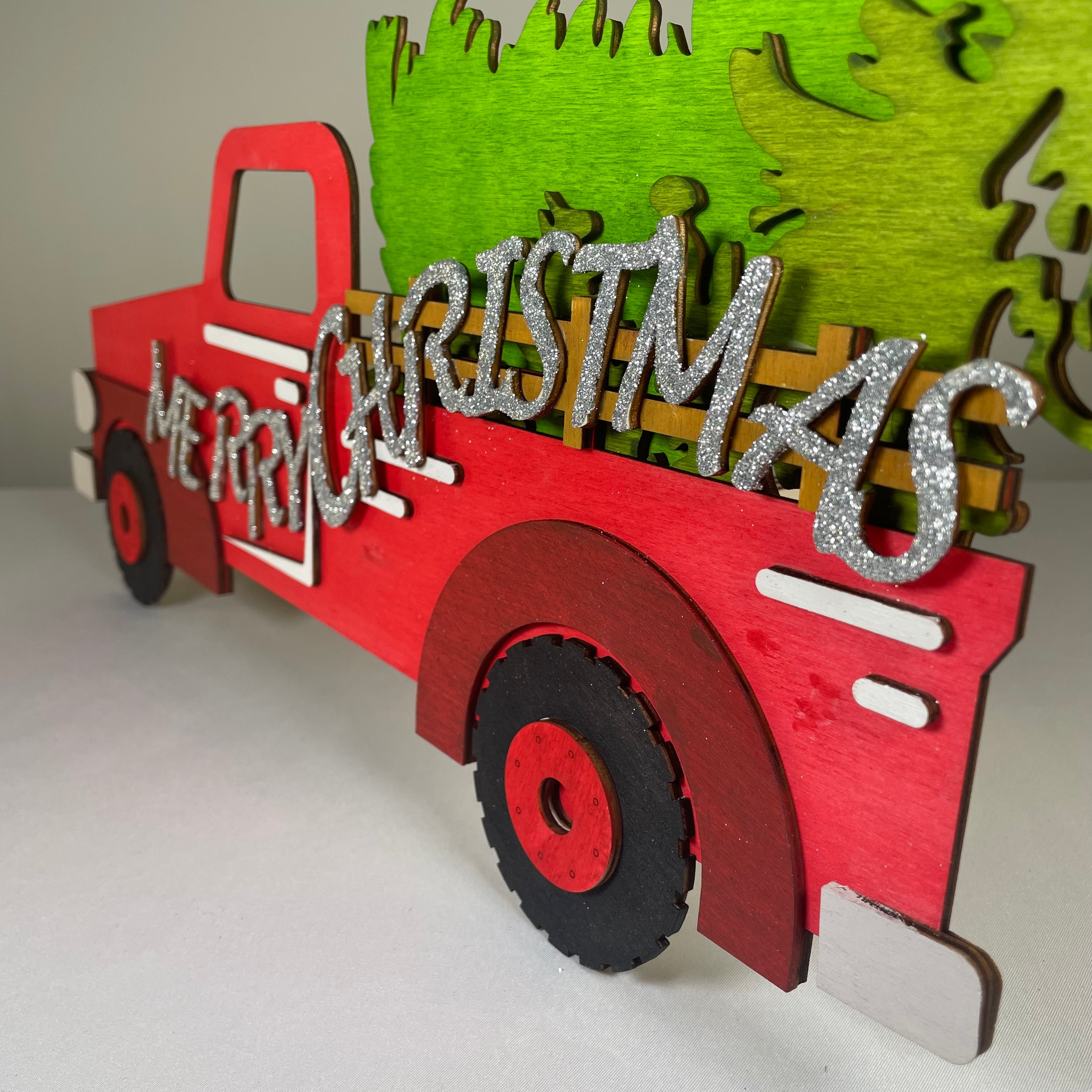 Handmade Curious Rabbit Merry Christmas truck tree sign ornament with festive holiday design for Christmas decoration.