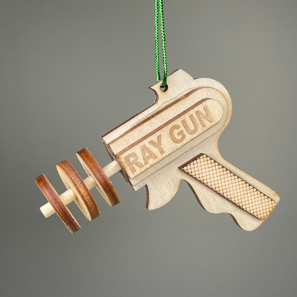 Vintage Curious Rabbit Ray Gun Bauble flatpack model kit, showing assembled colorful retro ray gun toy with intricate details.