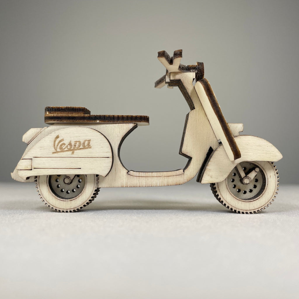 Handmade vintage Curious Rabbit Retro Scooter Bauble ornament hanging with intricate design and colorful details.