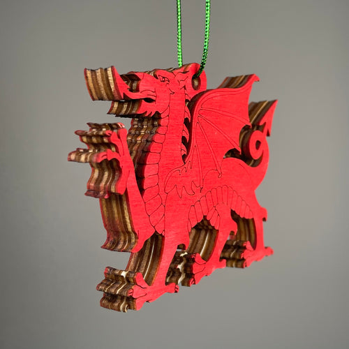 Handmade Welsh Dragon bauble ornament by Curious Rabbit featuring a colorful Welsh dragon design on a decorative holiday ornament.