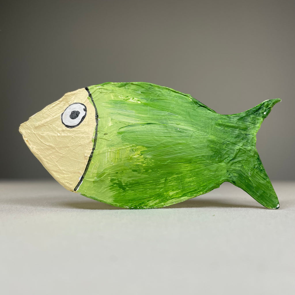 Handmade Curious Rabbit colourful fish beach ornament with vibrant glass bauble design on a sandy background.