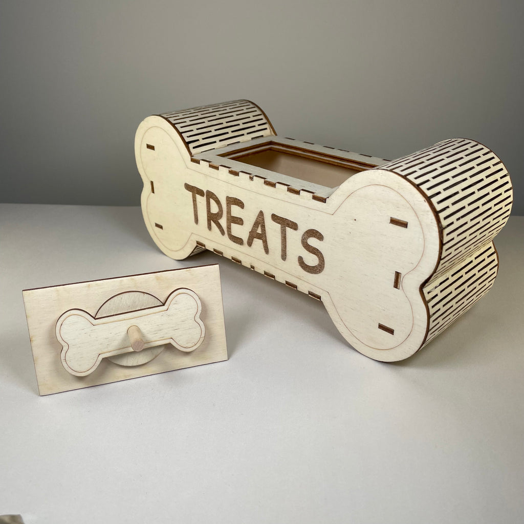 Curious Rabbit flatpack dog treat box kit with assembled cardboard storage for pet treats and accessories.