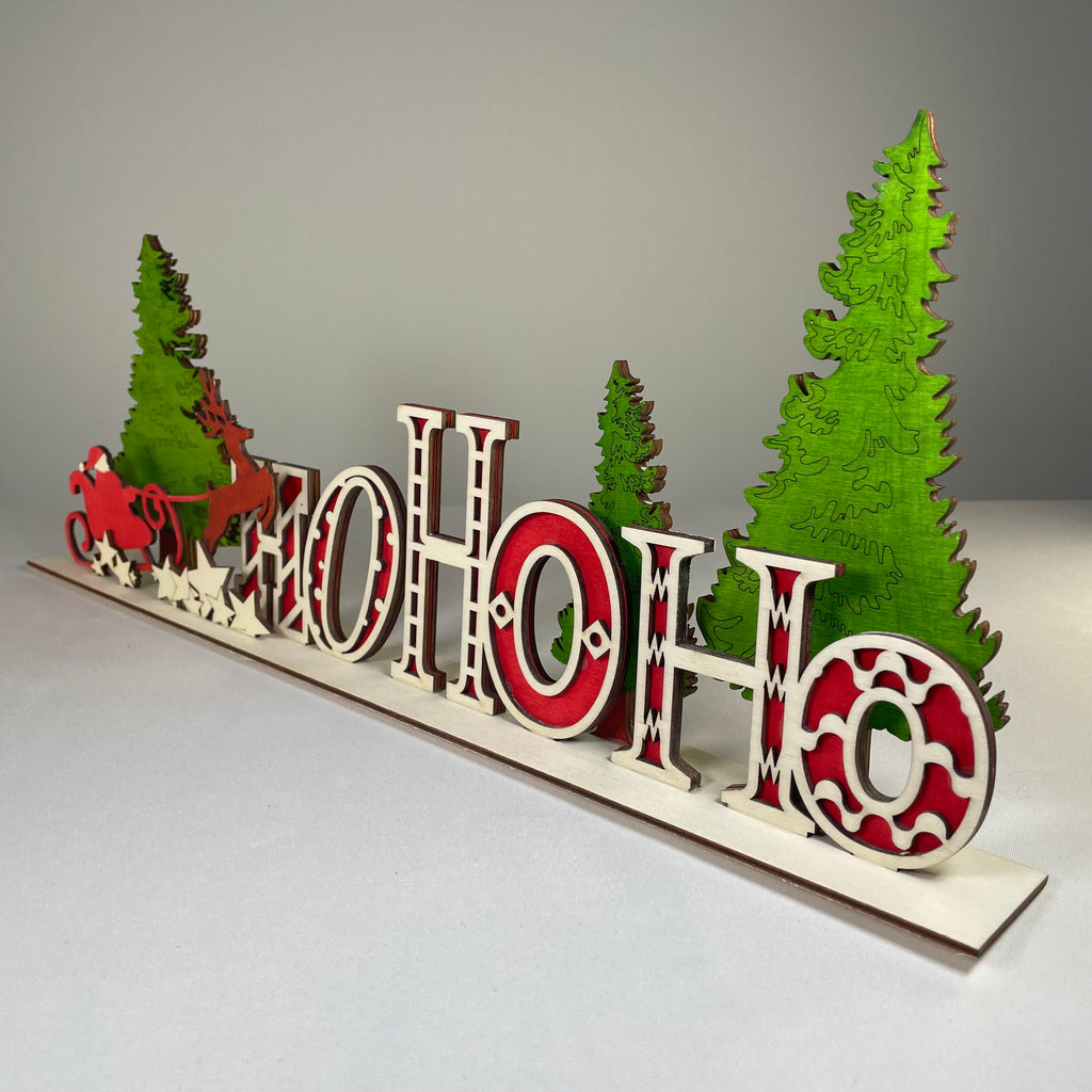 Handmade Curious Rabbit Christmas Ho Ho Ho sign ornament with festive red and white lettering for holiday decor.