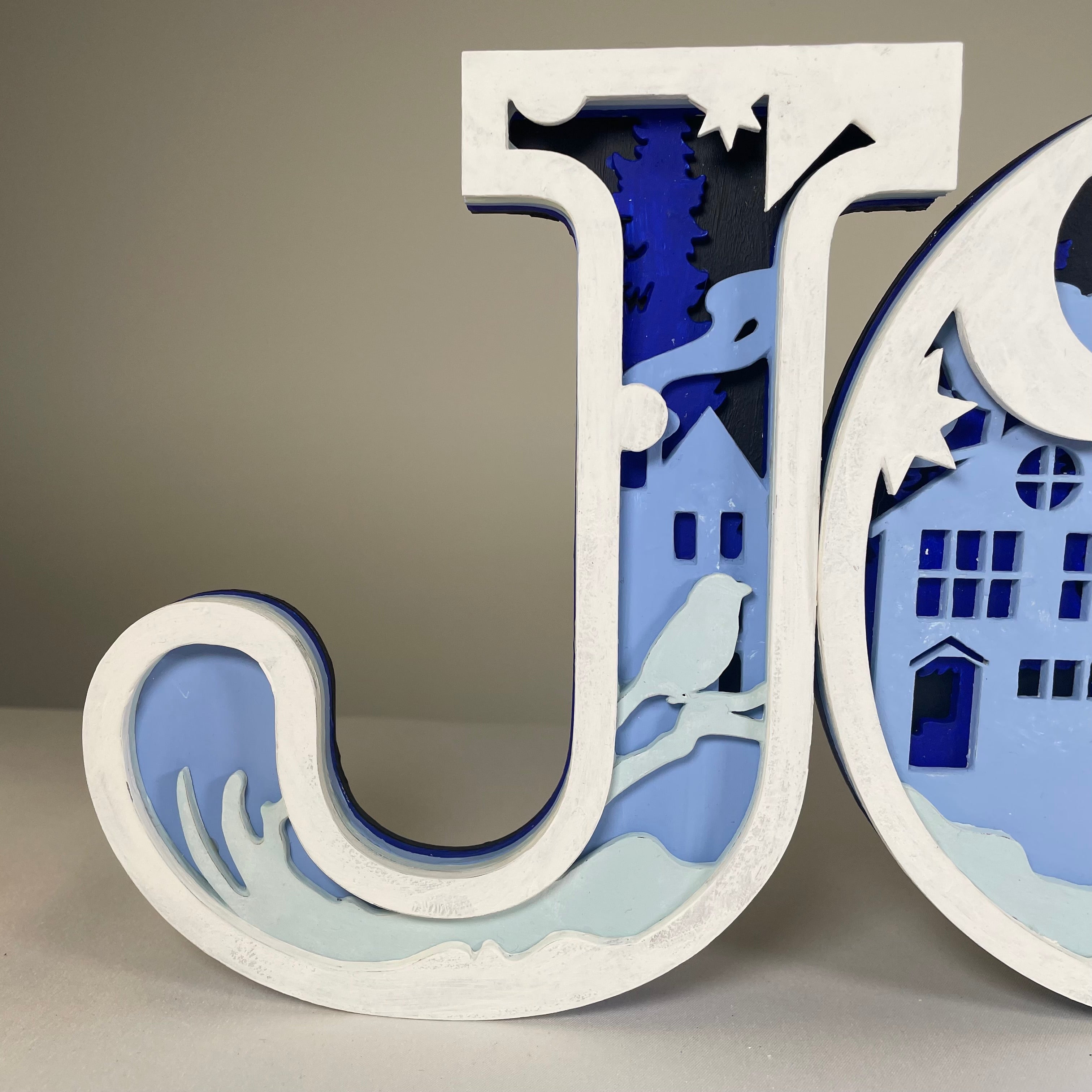 Handmade Christmas Joy sign ornament by Curious Rabbit, featuring a festive holiday design with cheerful lettering.
