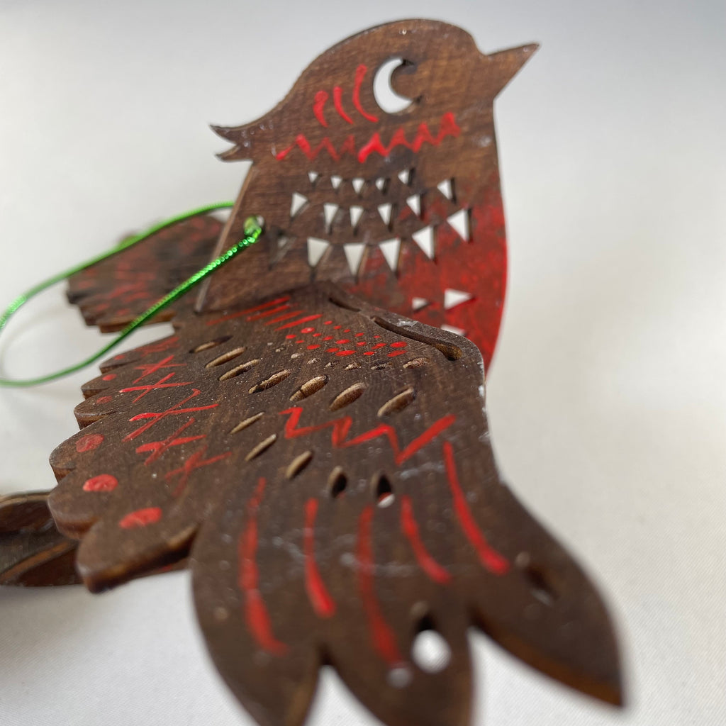 Handmade Christmas Bird Bauble ornament by Curious Rabbit, featuring a detailed bird design on a festive holiday decoration.