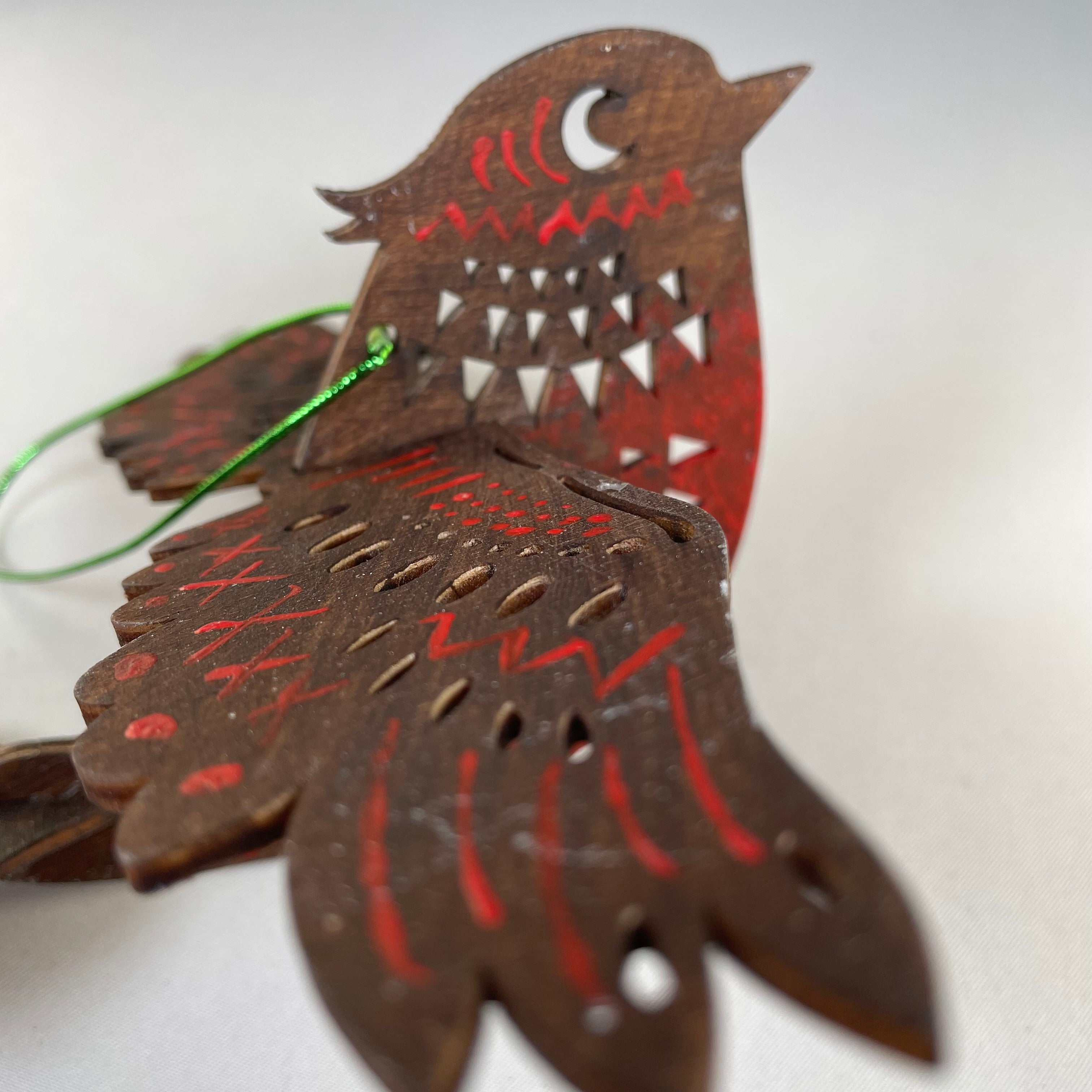 Handmade Christmas Bird Bauble ornament by Curious Rabbit, featuring a detailed bird design on a festive holiday decoration.