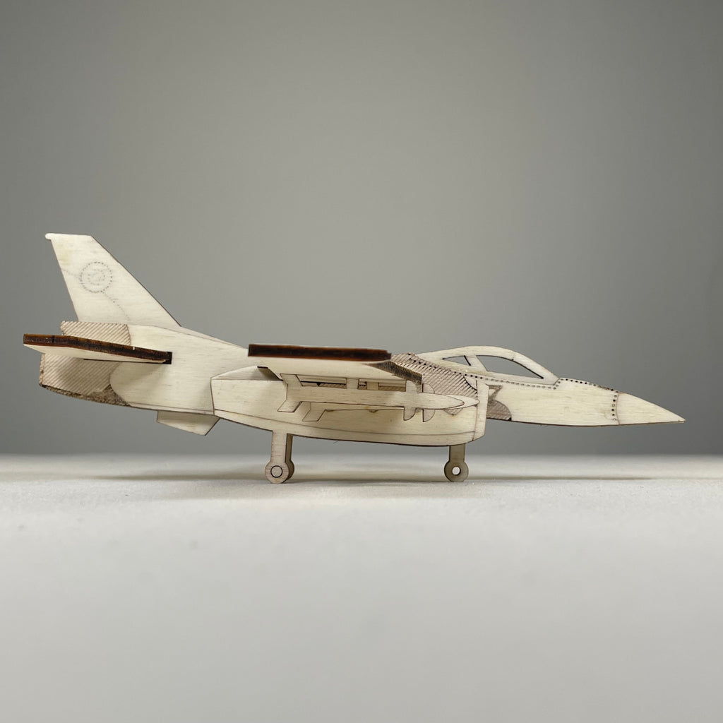 Curious Rabbit Jet Puzzle flatpack model kit depicting a vintage jet aircraft, assembled and ready for display.