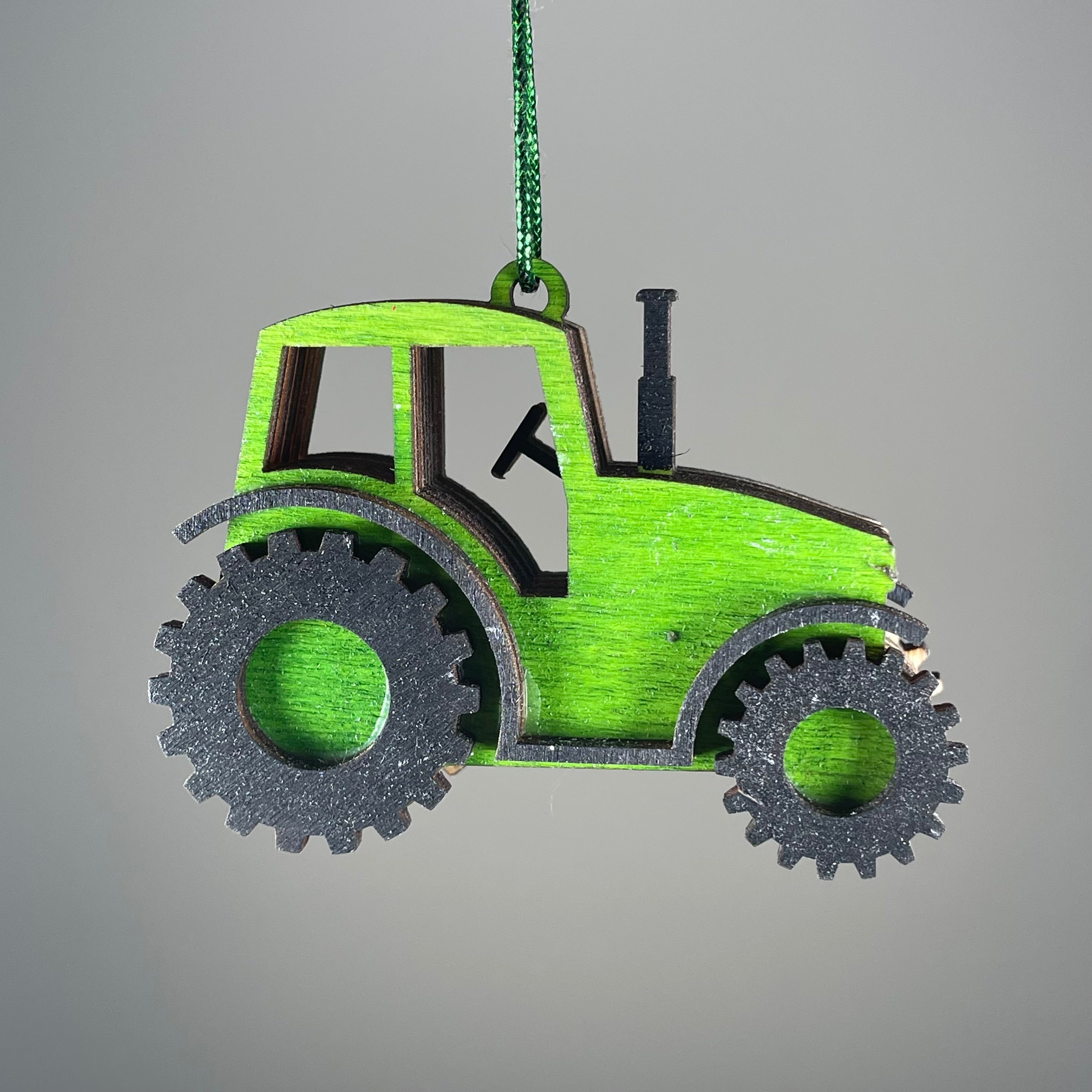 Handmade garden tractor bauble ornament by Curious Rabbit, featuring intricate details and a rustic wooden finish.