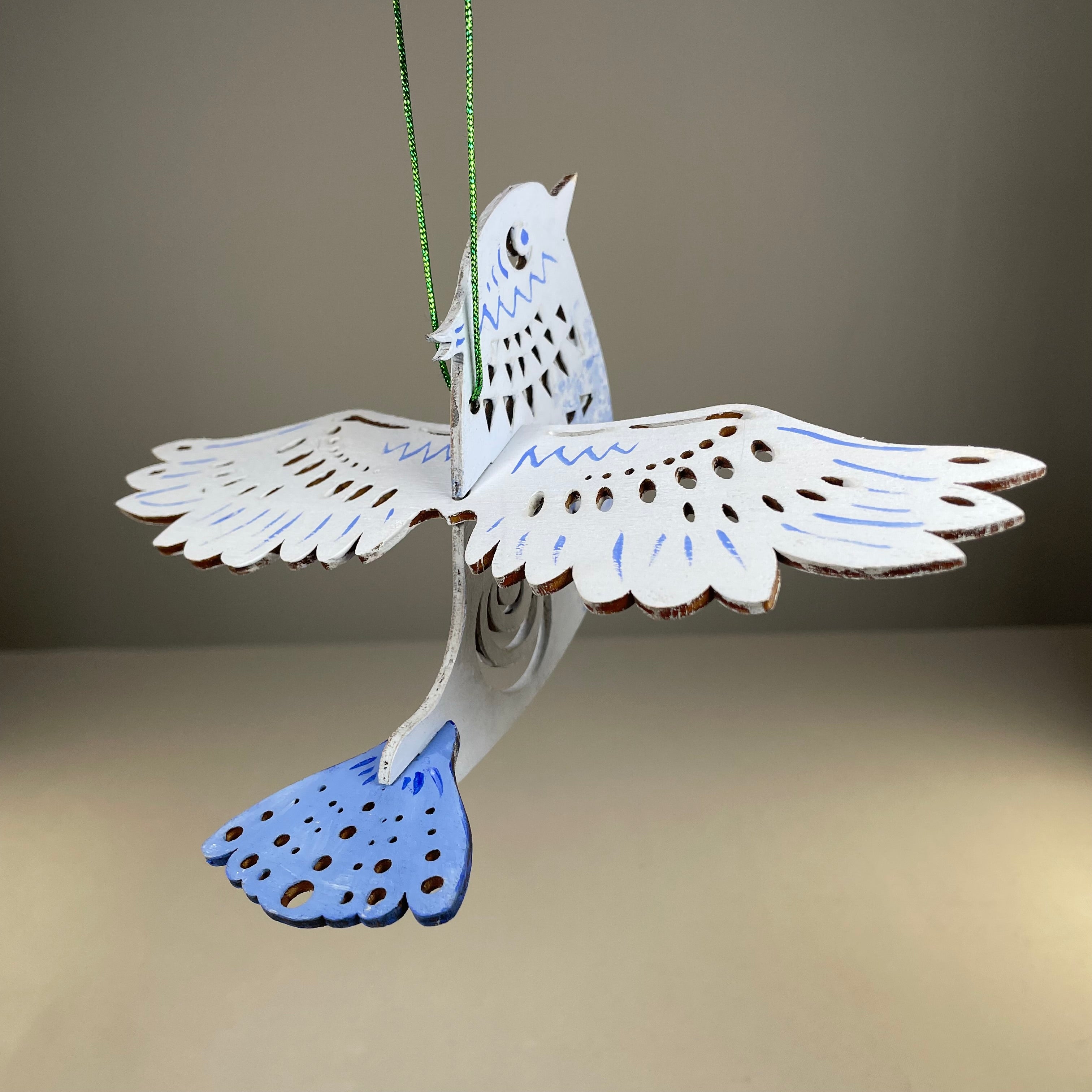 Handmade Christmas bird bauble ornament by Curious Rabbit, featuring detailed design and festive holiday decoration.