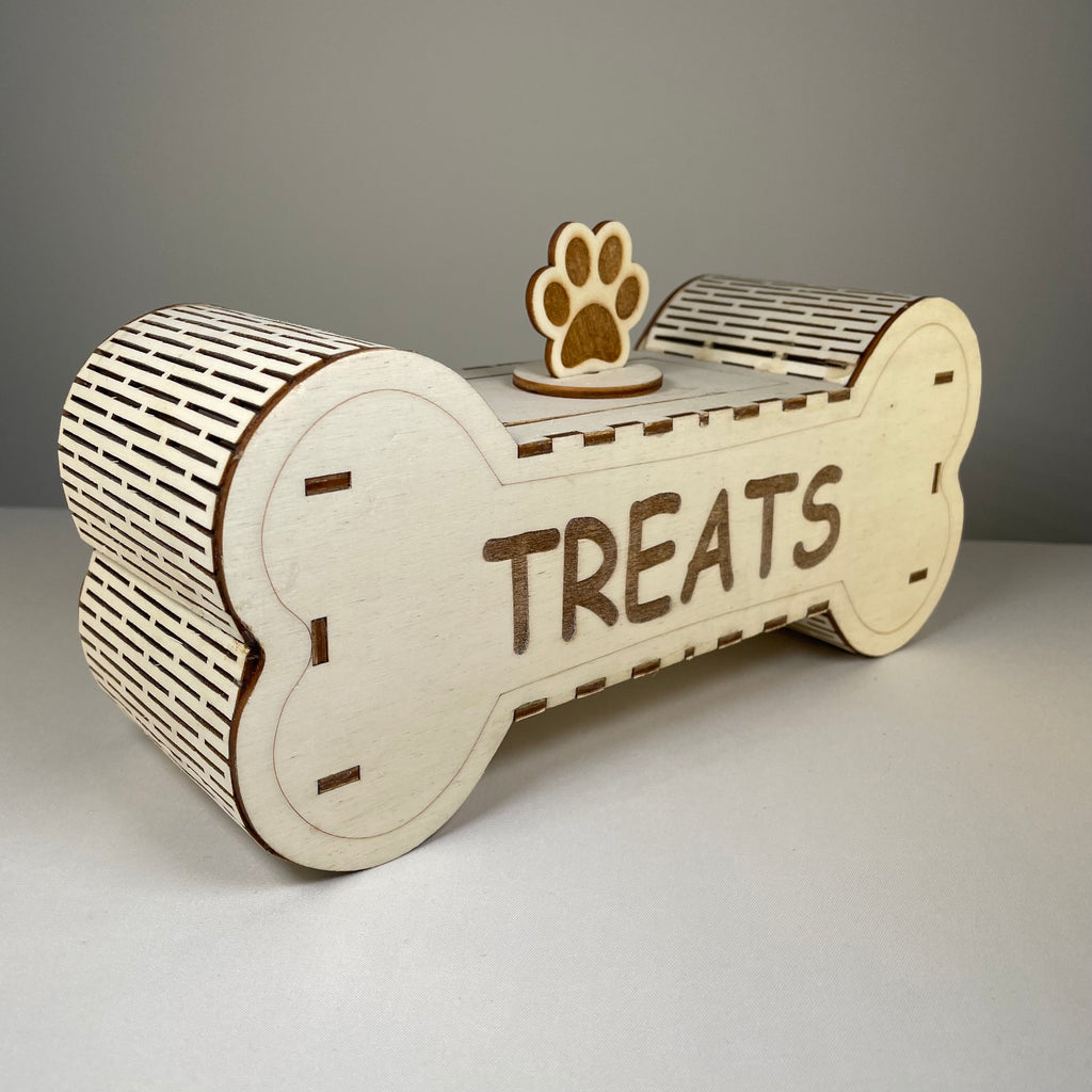 Curious Rabbit dog treat box flatpack model kit, pet accessory made of cardboard with assembled packaging and treat illustrations.