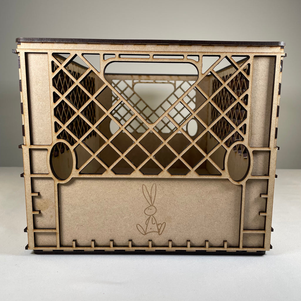 Vintage Curious Rabbit milk crate flatpack model kit assembled from wooden panels with open slats and sturdy construction.