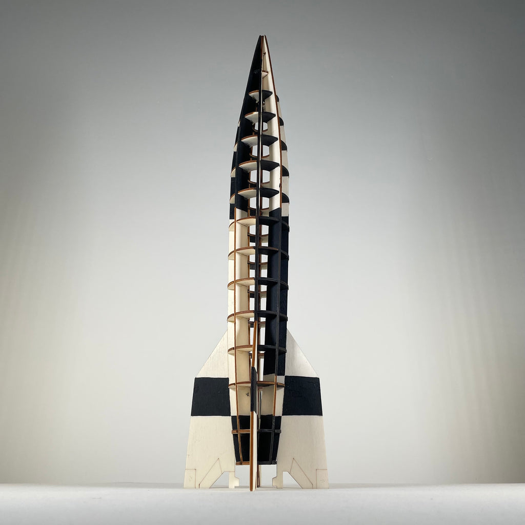 Curious Rabbit Prop V2 Rocket flatpack model kit for history enthusiasts, showing assembled rocket with detailed parts.