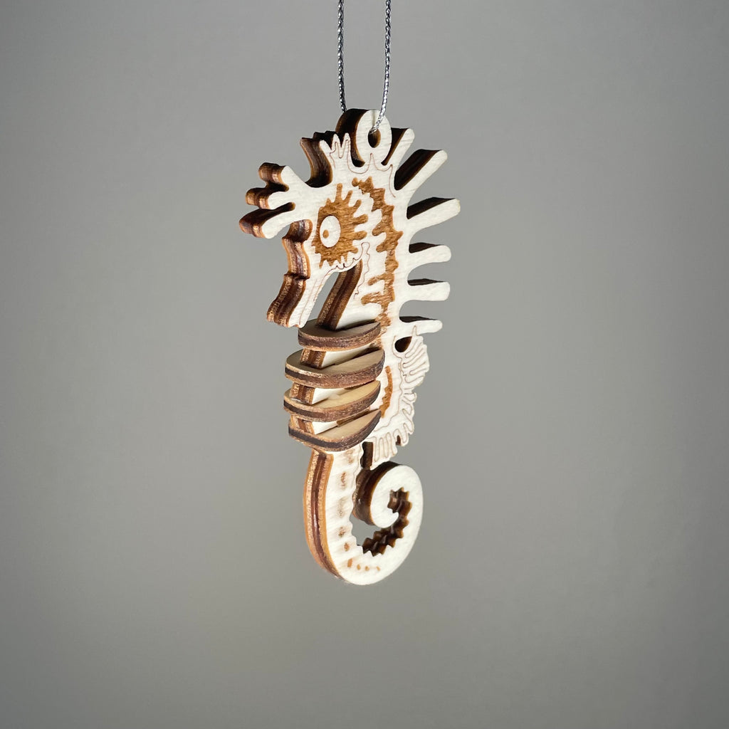 Curious Rabbit Seahorse Bauble flatpack model kit with beach-themed design, showing assembled colorful seahorse ornament.