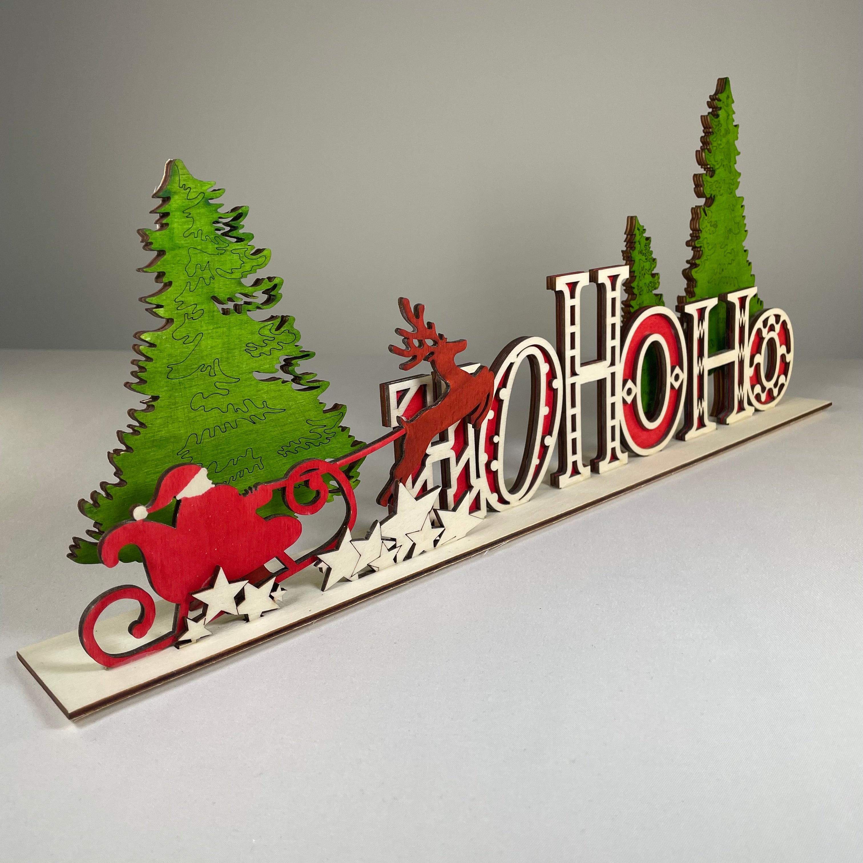 Handmade Christmas Ho Ho Ho sign ornament by Curious Rabbit, festive wooden decoration with holiday lettering.