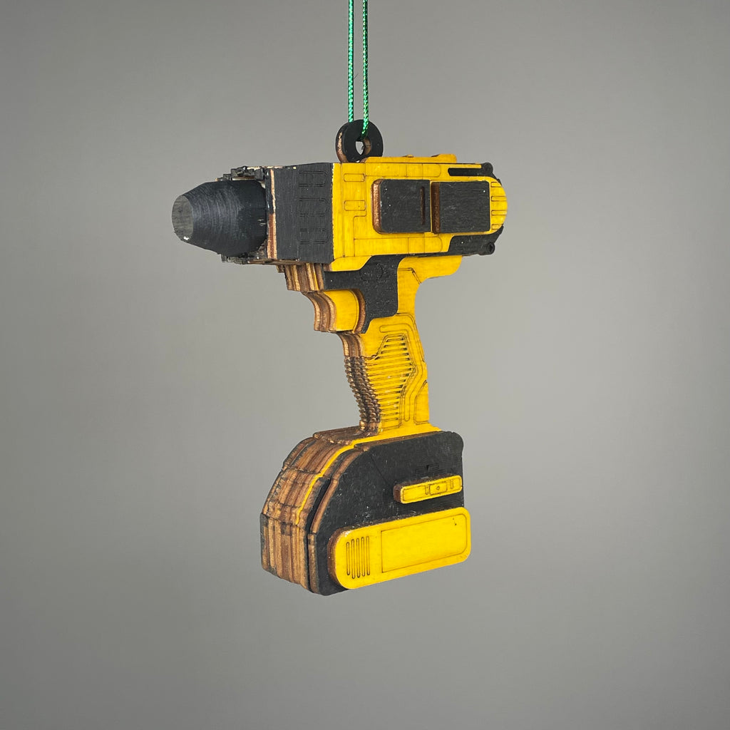 Handmade Curious Rabbit power drill-themed toolbox ornament with a playful, crafted design for decorative display.