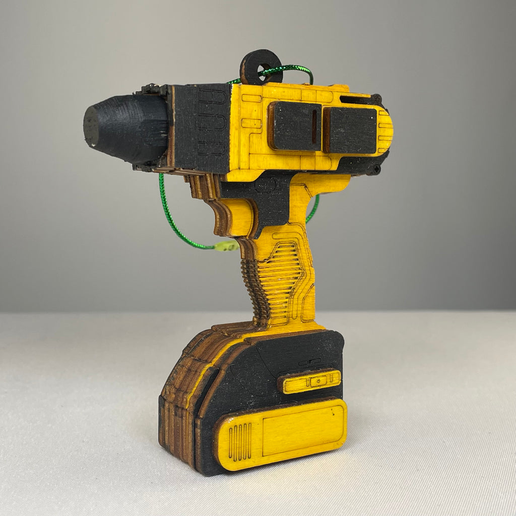 Handmade Curious Rabbit toolbox ornament shaped like a power drill bauble, detailed and colorful for decorative display