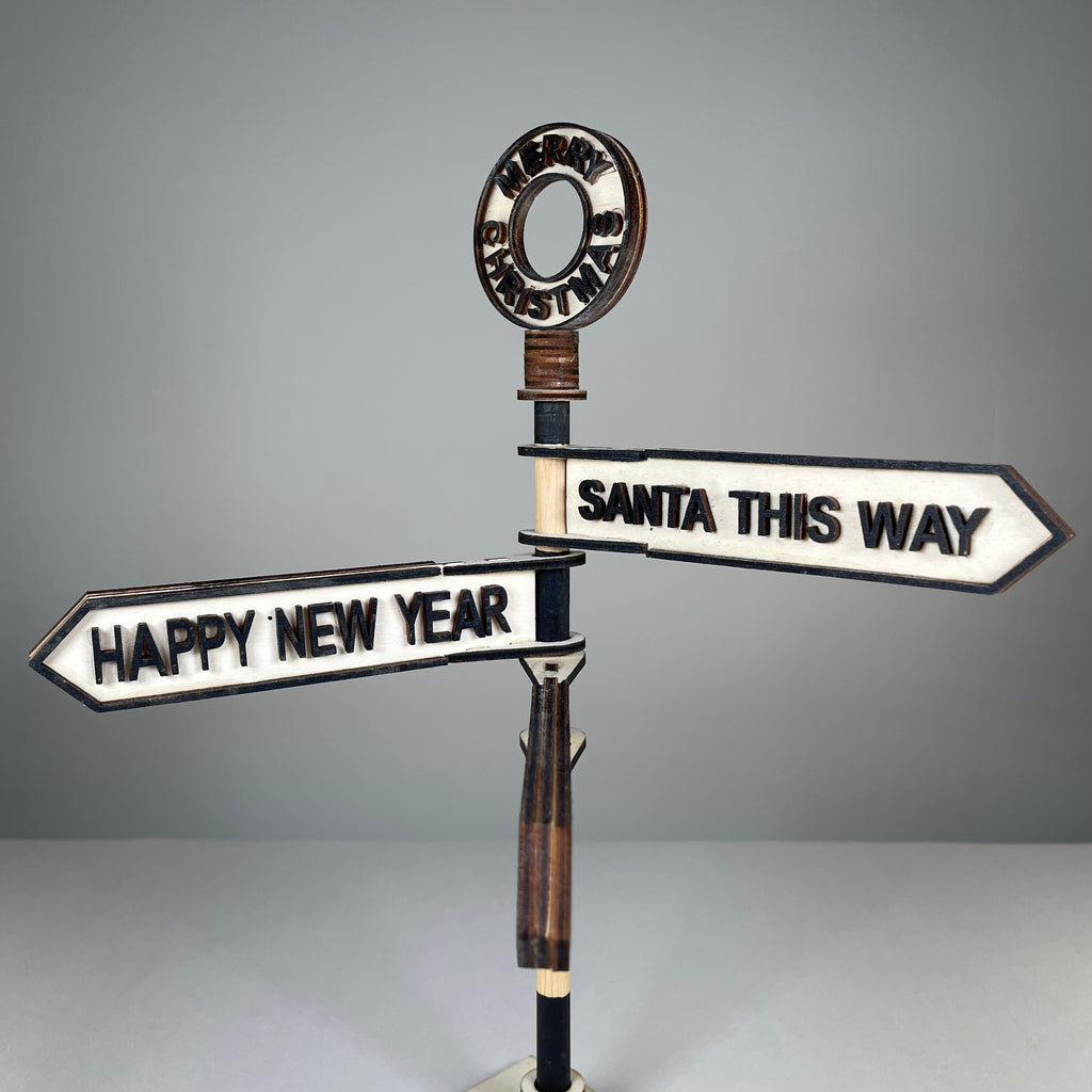 Handmade Curious Rabbit Christmas direction sign ornament with festive holiday design and colorful arrows for Christmas decor.