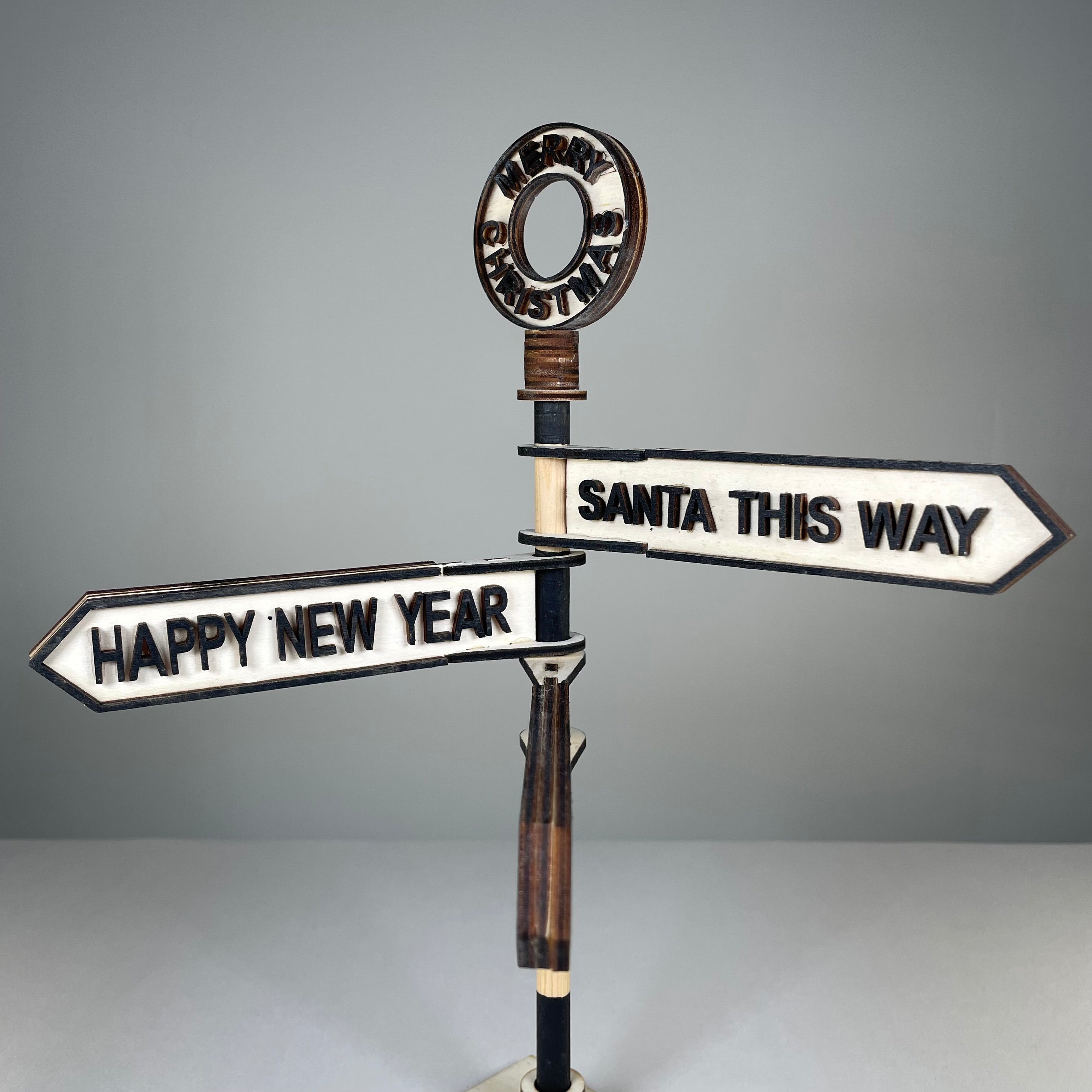 Handmade Curious Rabbit Christmas direction sign ornament with festive holiday design and colorful arrows for Christmas decor.