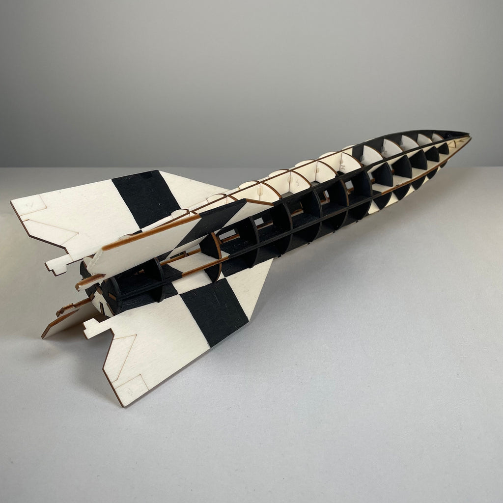 Curious Rabbit Prop V2 Rocket flatpack model kit, detailed history replica with assembled parts and vibrant colors.