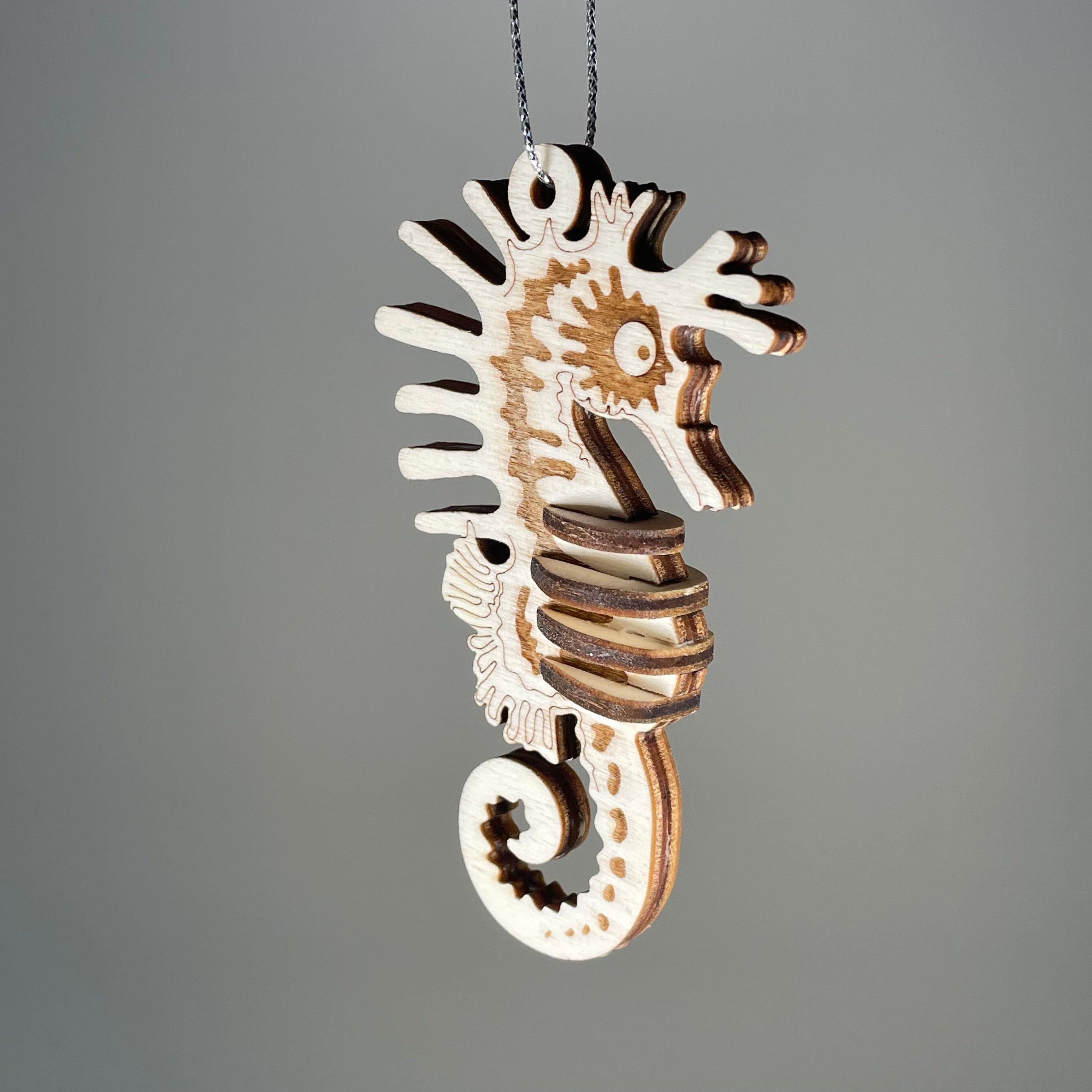 Curious Rabbit Seahorse Bauble flatpack model kit featuring a detailed beach-themed seahorse design.