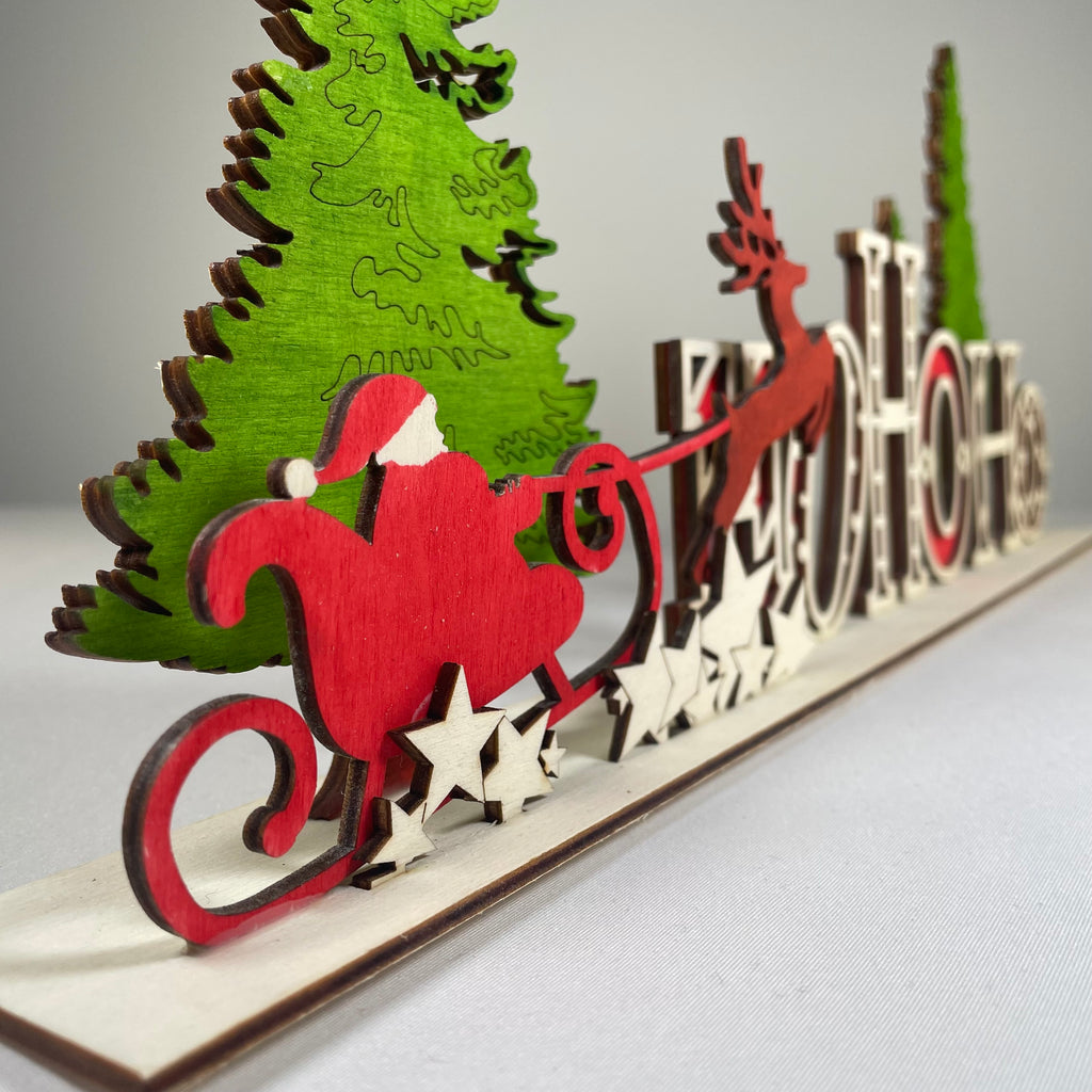 Handmade Christmas Ho Ho Ho sign ornament by Curious Rabbit, featuring festive holiday lettering and rustic design.