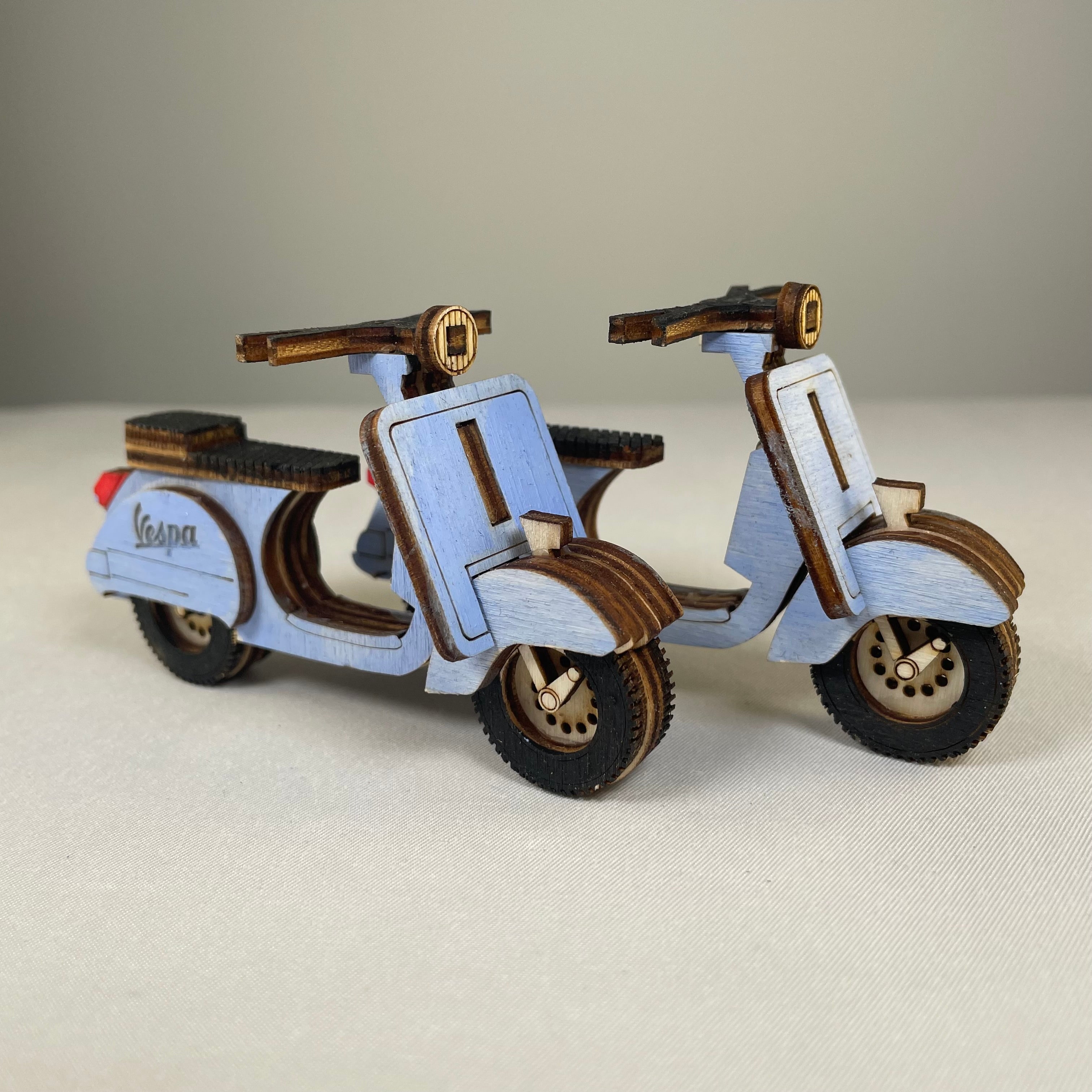 Vintage Retro Scooter flatpack model kit by Curious Rabbit, assembled with colorful parts and detailed vintage design.