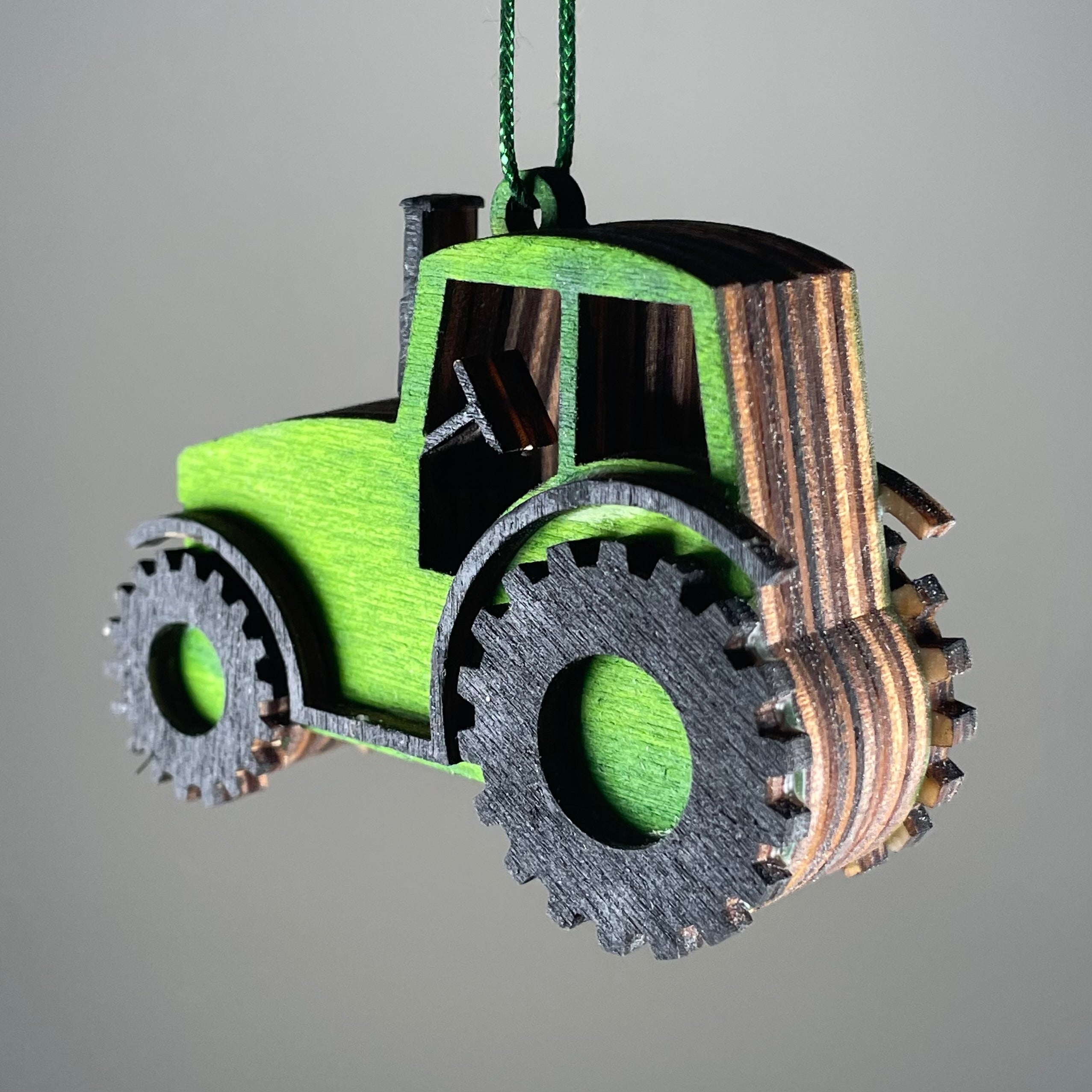 Handmade garden tractor bauble ornament by Curious Rabbit, featuring detailed craftsmanship and rustic charm for outdoor decor.