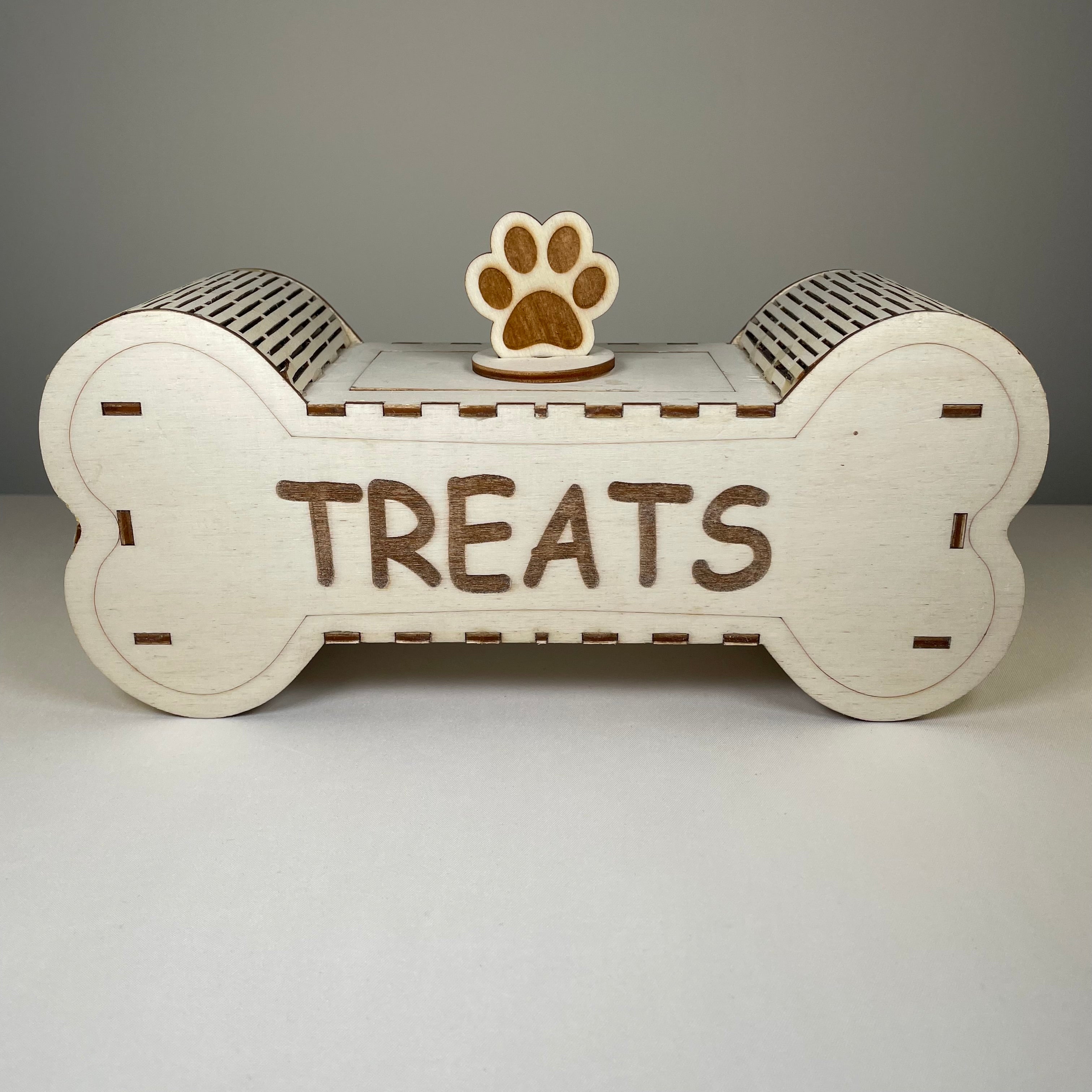 Curious Rabbit flatpack dog treat box kit for pets, shown assembled with treats inside, natural wood finish and compact design.