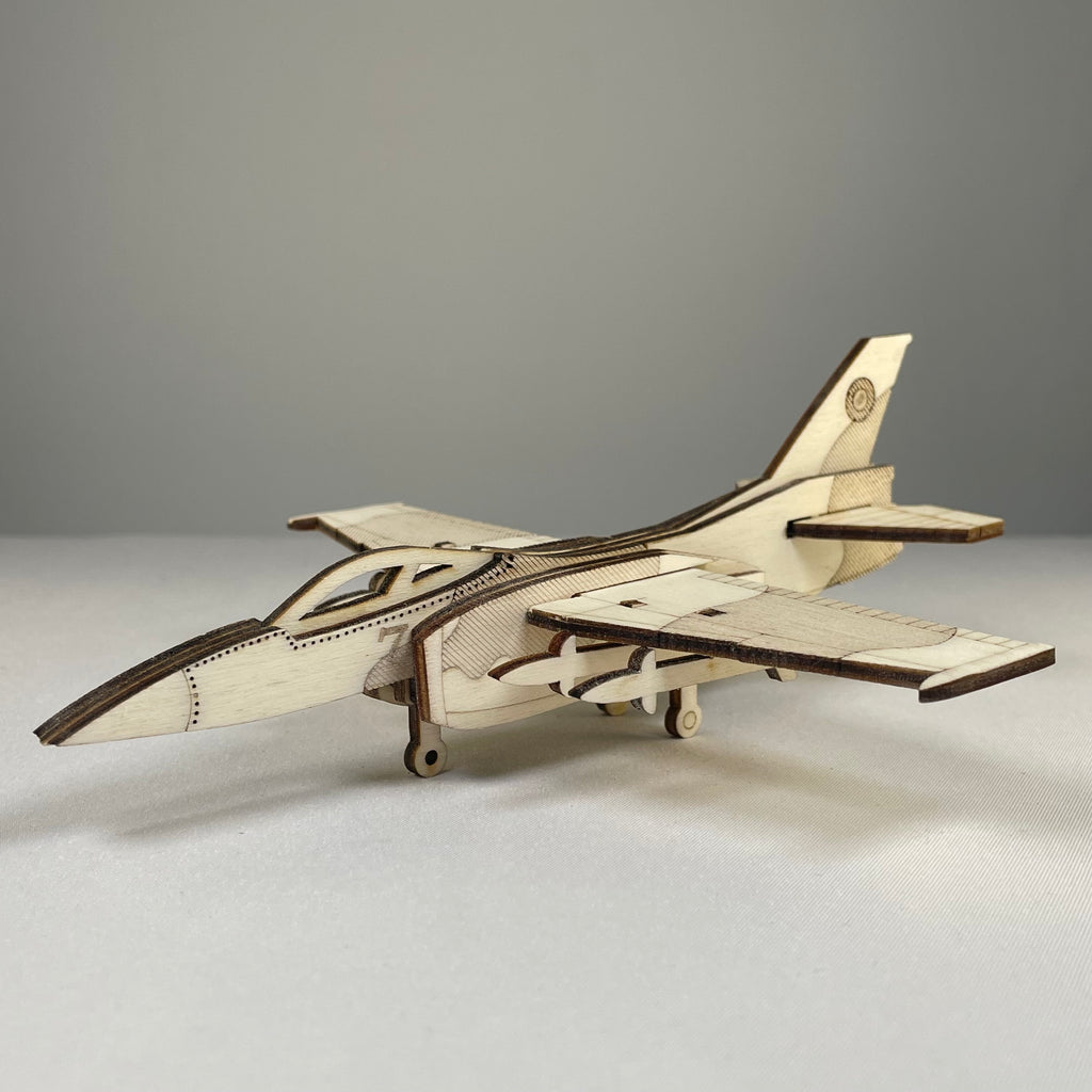 Curious Rabbit Jet Puzzle flatpack model kit, history-themed, assembled jet aircraft with detailed parts and vibrant colors.