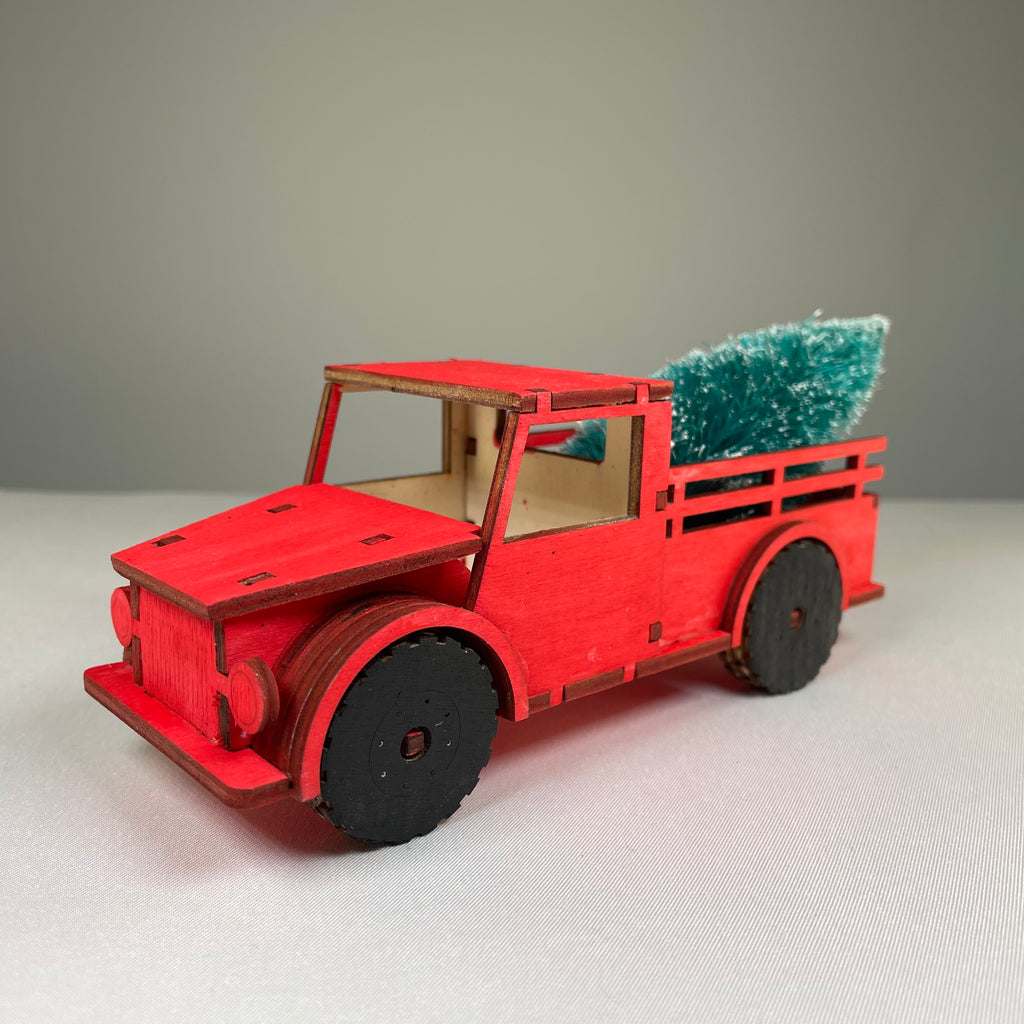 Curious Rabbit Christmas truck flatpack model kit with a Christmas tree, ready for assembly, festive holiday decoration.
