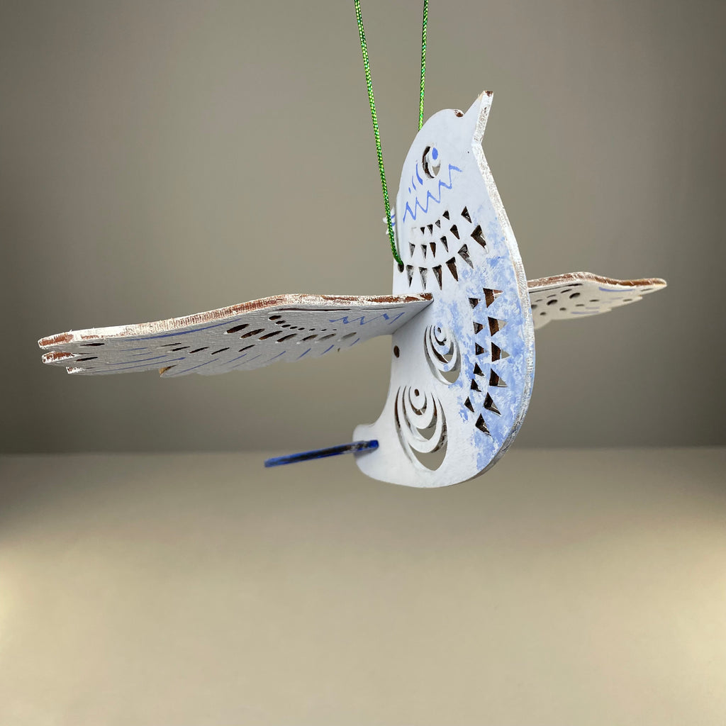 Handmade Christmas bird bauble ornament by Curious Rabbit, featuring colorful bird design on a festive holiday decoration