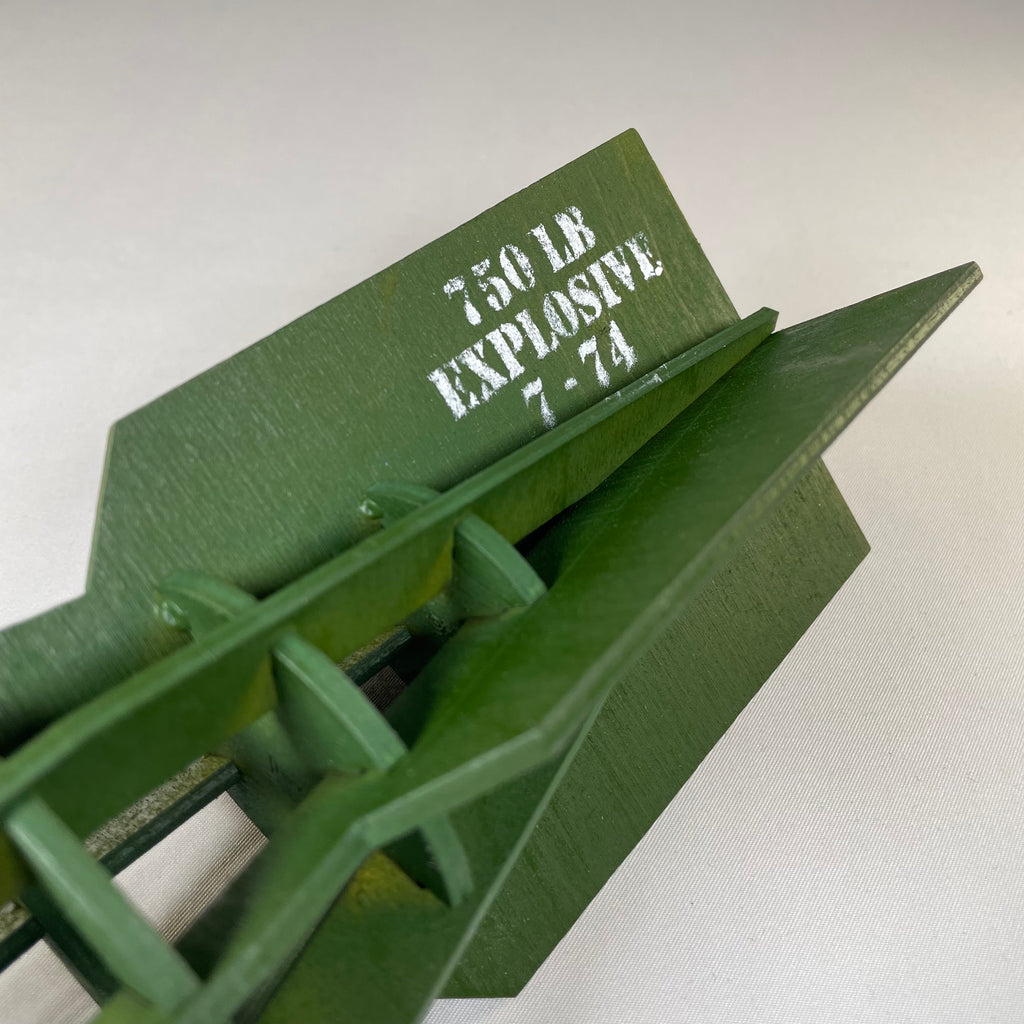 Curious Rabbit WW2 bomb flatpack model kit, detailed history replica, assembled with visible parts and realistic design elements.