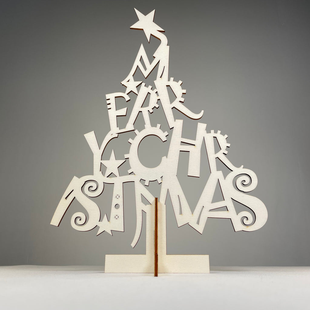 Curious Rabbit Christmas Tree flatpack model kit with assembled paper tree and decorative ornaments for holiday display.