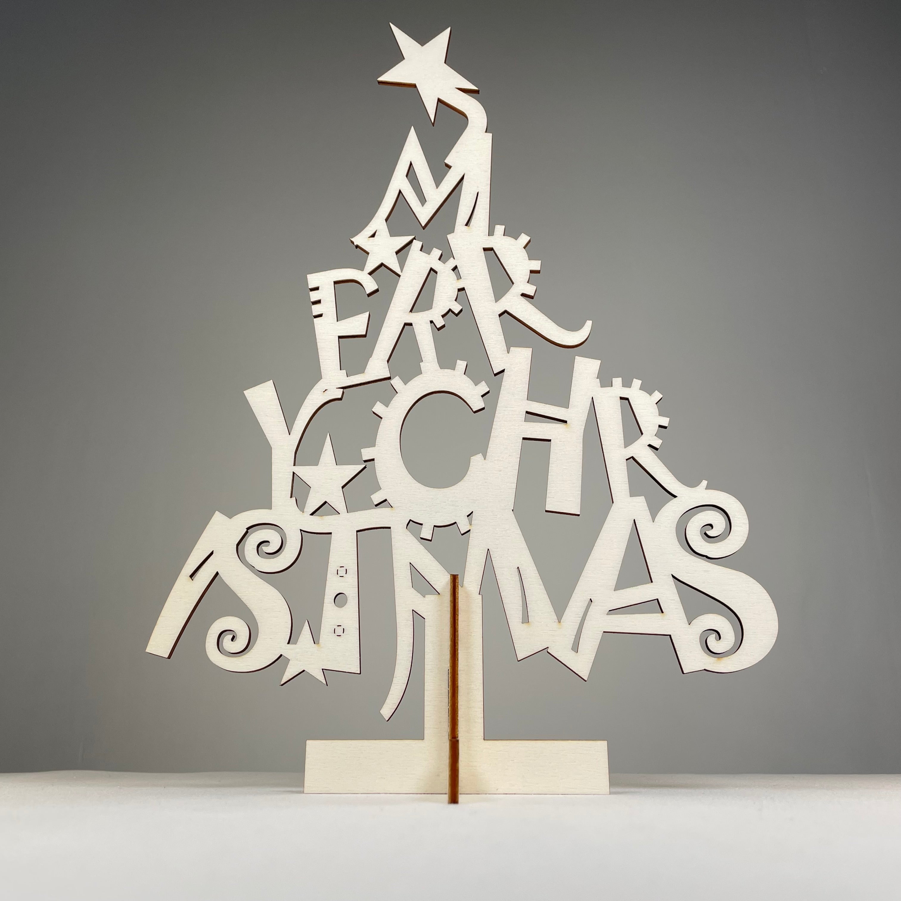 Curious Rabbit Christmas Tree flatpack model kit with assembled paper tree and decorative ornaments for holiday display.
