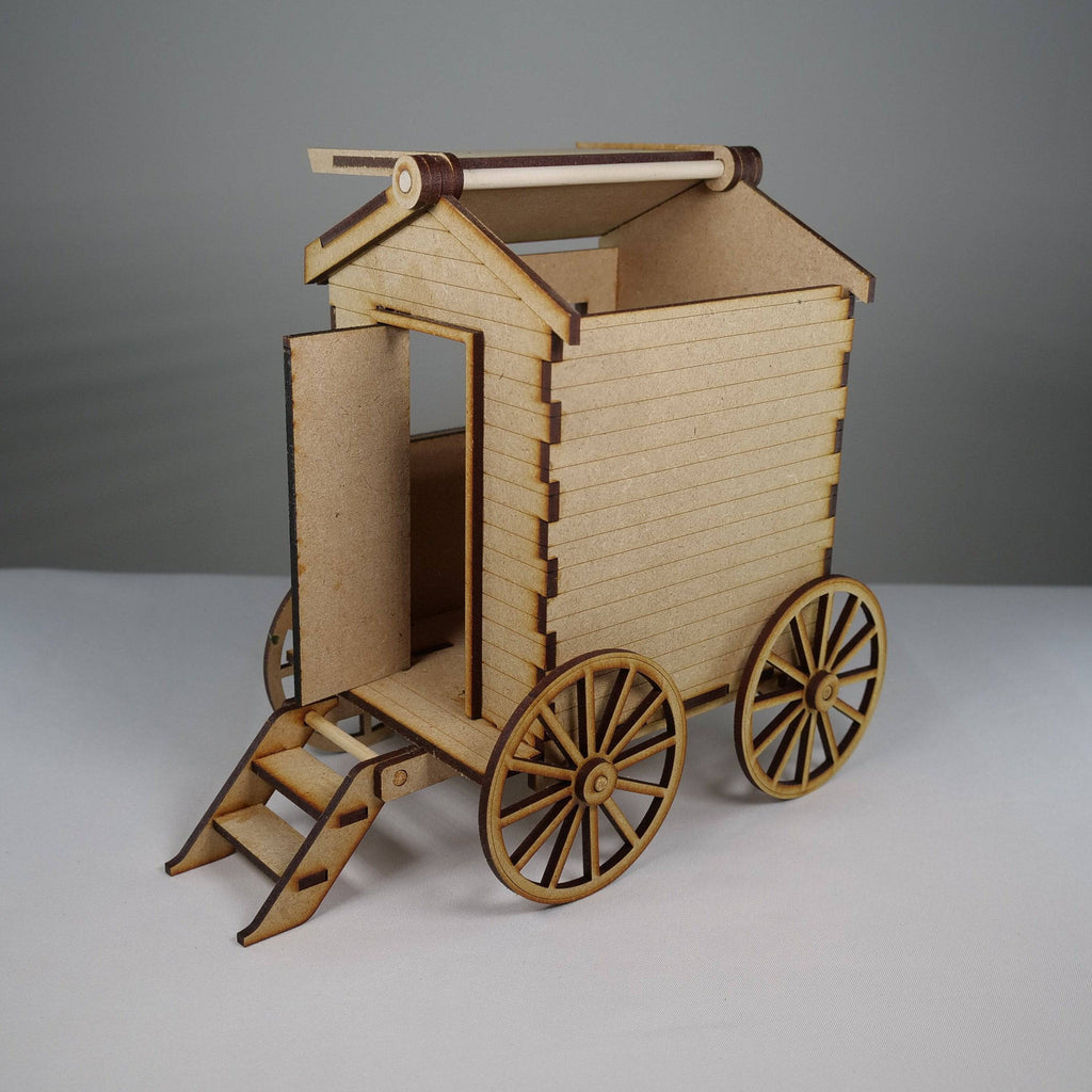 Curious Rabbit Beach Bathing Hut flatpack model kit with detailed beach scene and miniature hut in natural setting.