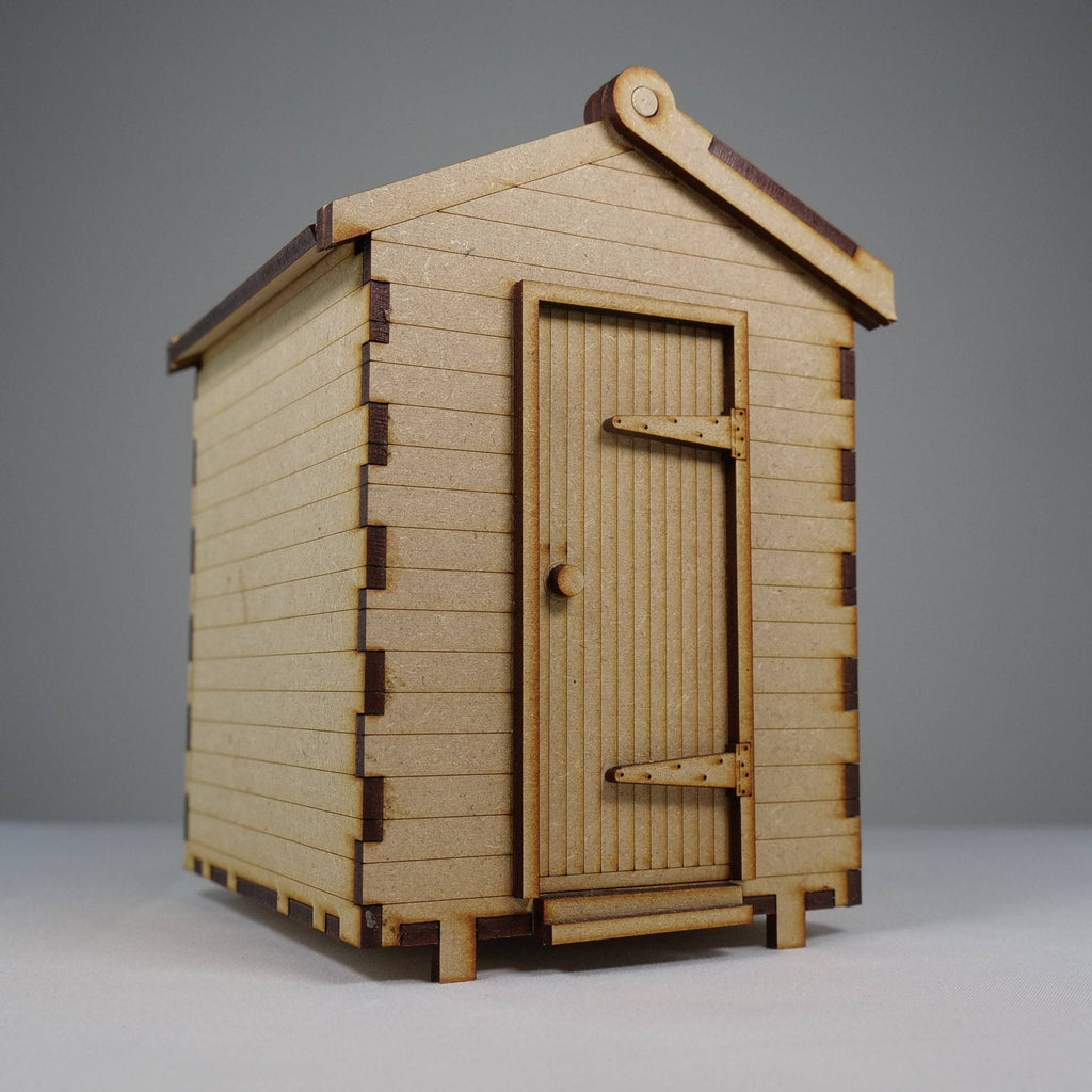 Curious Rabbit beach hut flatpack model kit with colorful beach hut design, perfect for DIY beach scene decorations.