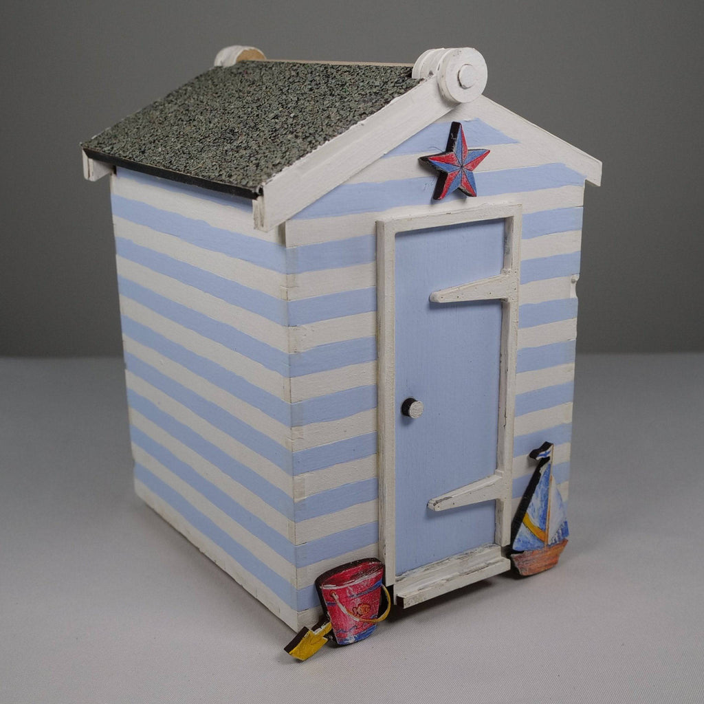 Curious Rabbit Beach Hut flatpack model kit featuring a detailed miniature beach hut with vibrant colors and realistic design.