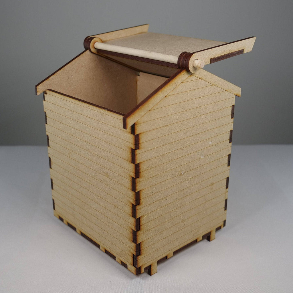 Curious Rabbit beach hut flatpack model kit with detailed miniature beach scene and colorful beach hut design.